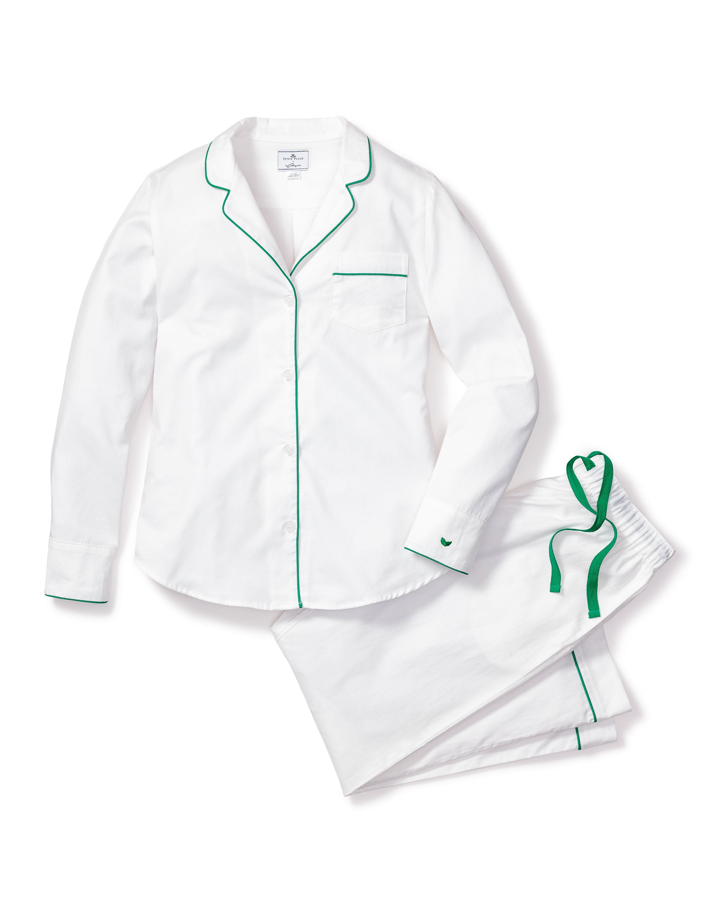 Indulge in luxury with Petite Plumes Womens White Twill Pajama Set. Made from 100% cotton, this elegant set features a long-sleeve button-up top with a chest pocket and collar, paired with drawstring pants, both adorned with stylish green piping for a sophisticated touch.