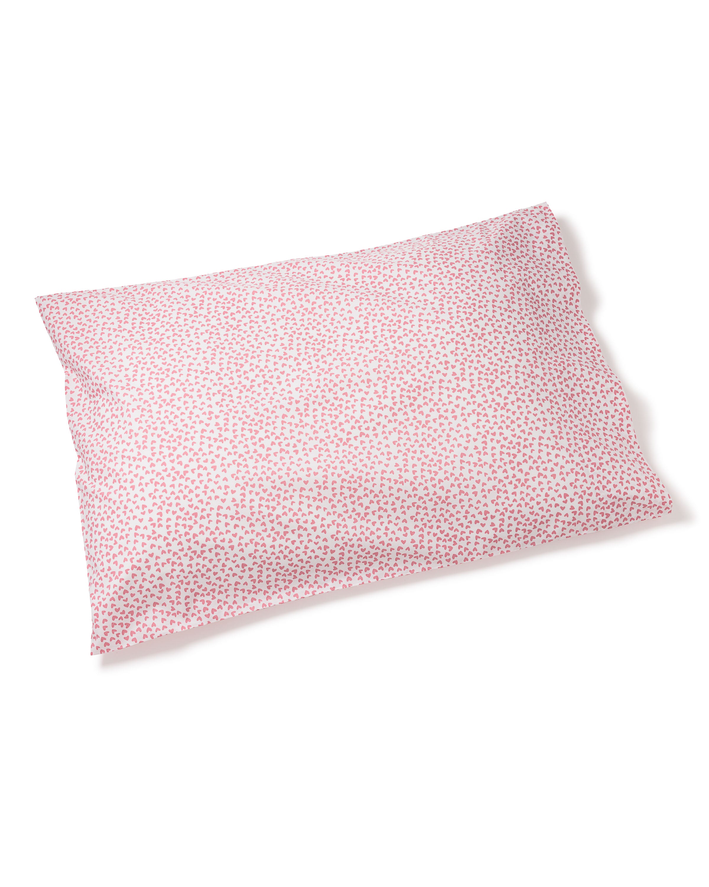 The Luxe Premium Cotton Sweethearts Pillow by Petite Plume features a pink and white design with small floral patterns, echoing luxury sheets. Its surface is adorned with tiny pink flowers on a pristine white backdrop, crafted from 100% cotton in a simple rectangular shape.