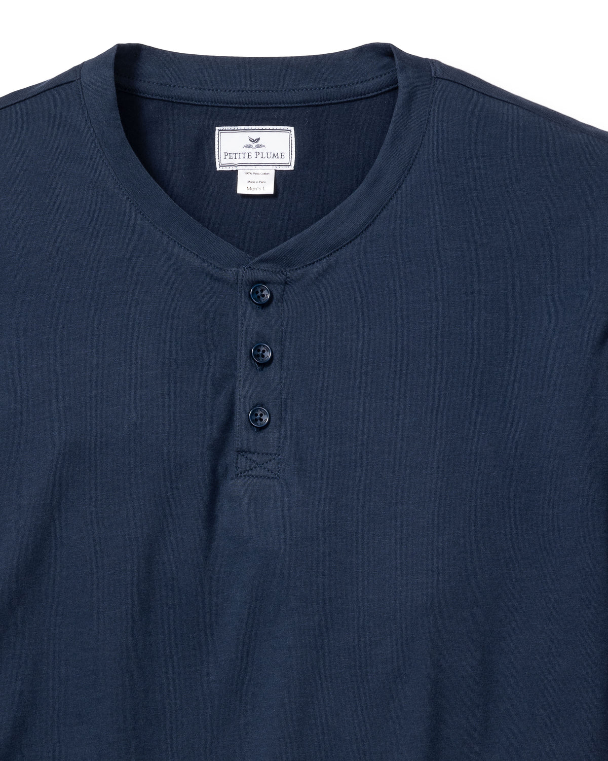 The Mens Pima Henley in Navy by Petite Plume features a soft Peruvian Pima cotton fabric and a classic three-button placket. Its simple design makes it an ideal addition to your bedtime routine, displayed on a white background for clarity.