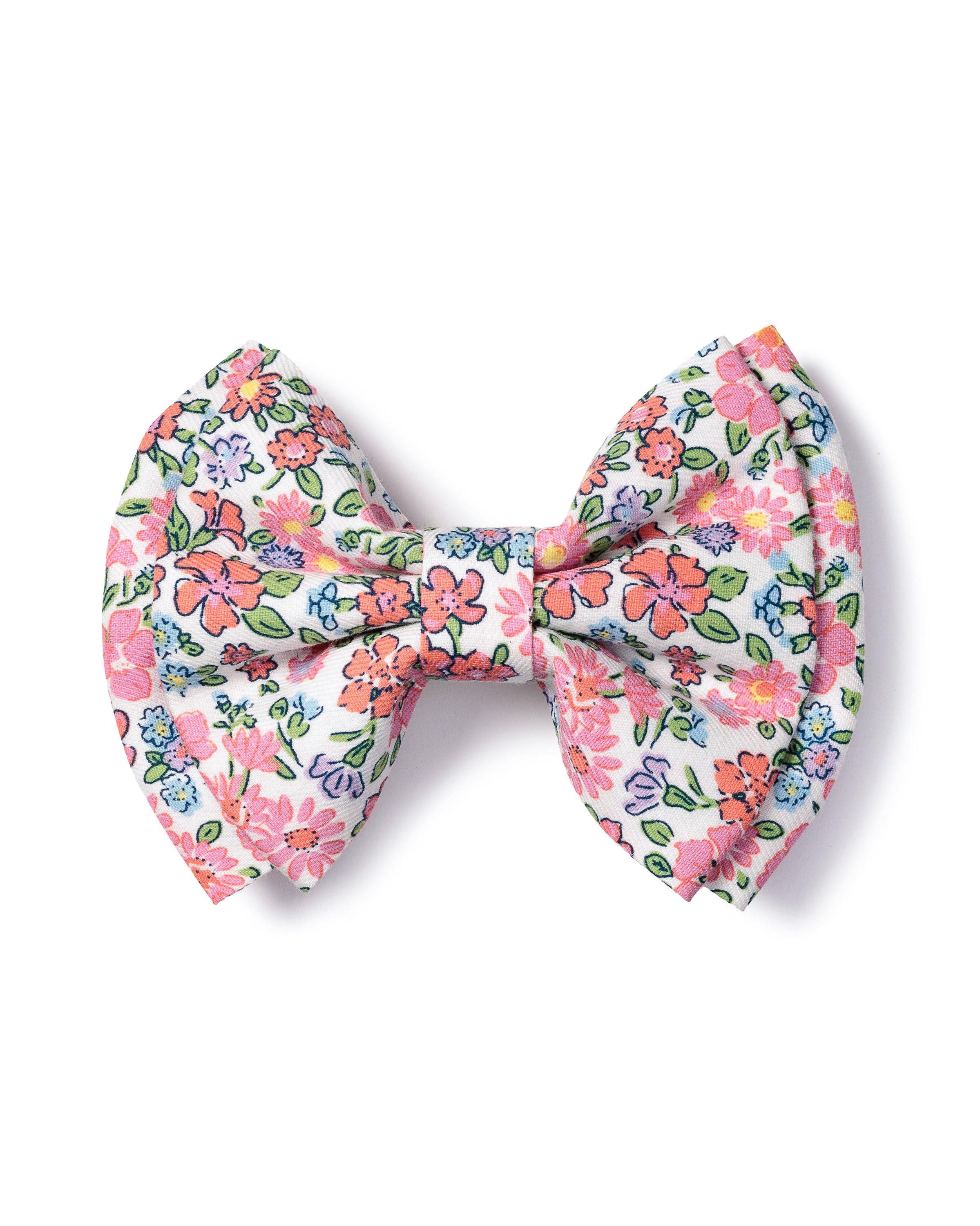 Petite Plume’s Girls Hair Bow in Fleurs de Rose is crafted from charming fabrics, showcasing pink, red, and blue flowers on a white background. Its symmetrical loops and tails make it a cheerful accessory for decorative flair.