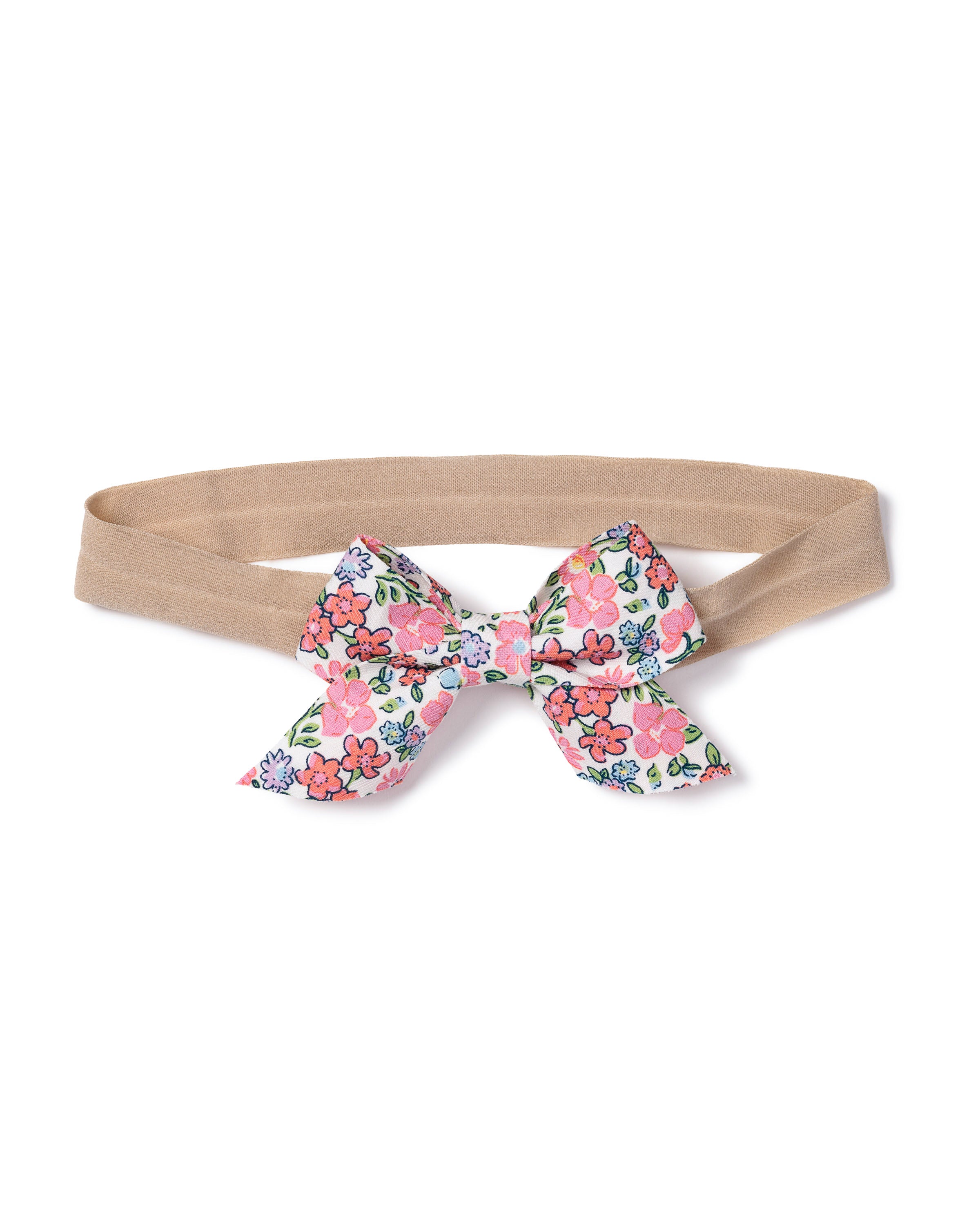 The Petite Plume Girls Hair Bows in Fleurs de Rose feature a beige headband with a charming fabric bow adorned with pink, blue, and red floral patterns and green leaves on white. Its the ideal accessory to enhance any vibrant look.
