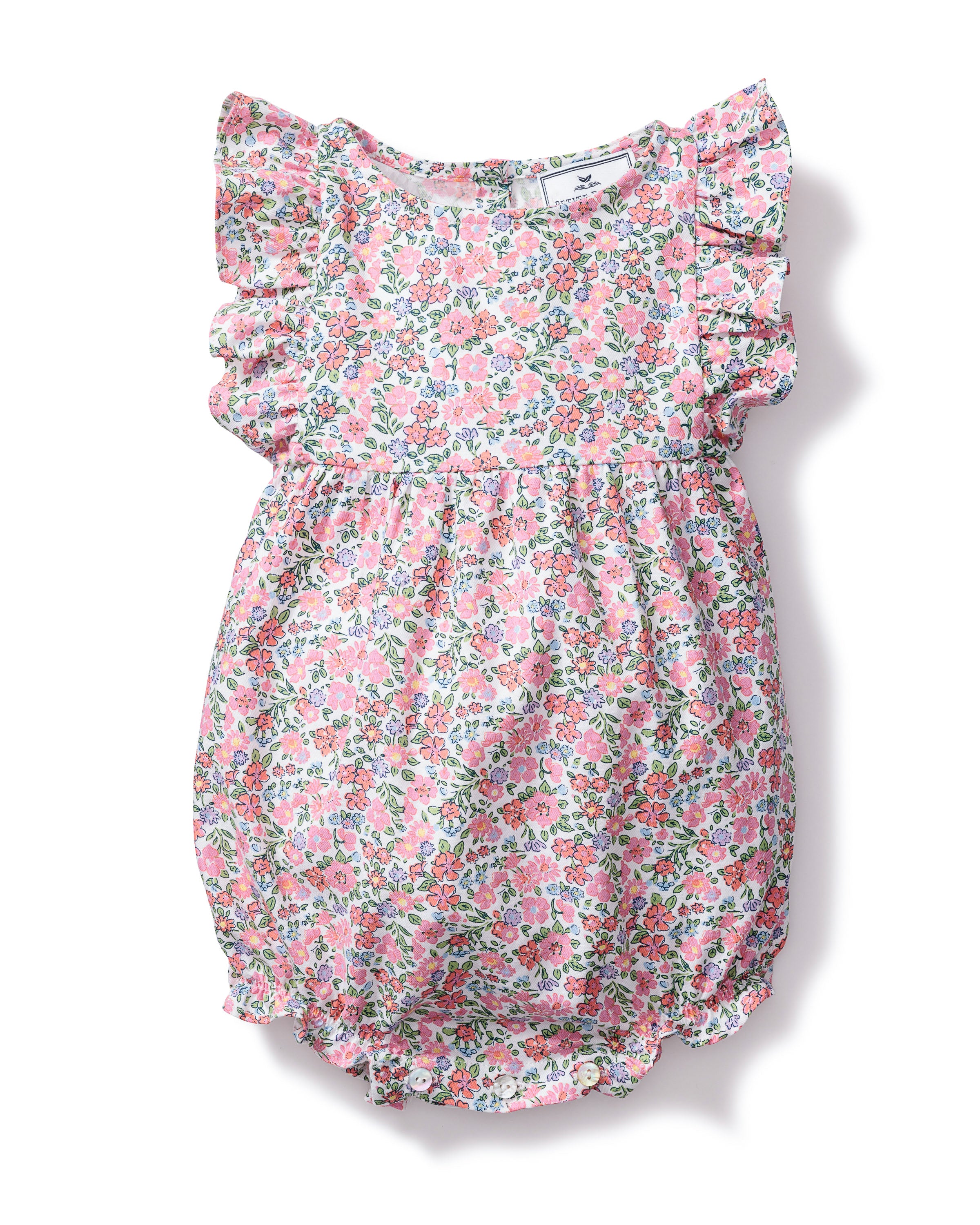 The Babys Twill Ruffled Romper in Fleurs de Rose by Petite Plume showcases a pink floral print with blue and green accents. Made from high-quality cotton, it features ruffled sleeves and elastic leg openings for a playful look.