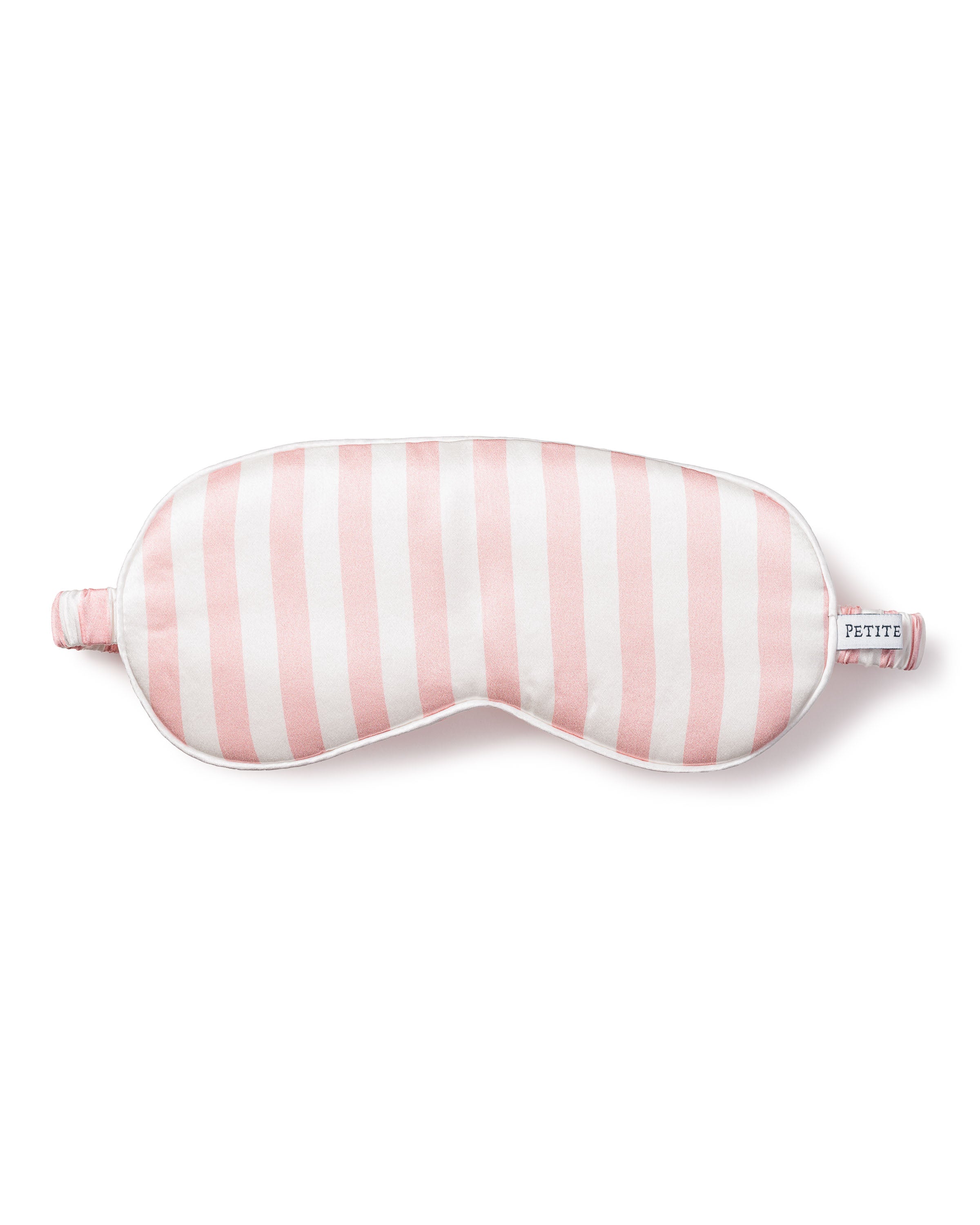 The Womens Silk Sleep Mask in Pink Stripe from Petite Plume features a cushioned design for luxurious comfort and a PETITE label on its strap, enhancing your rest.