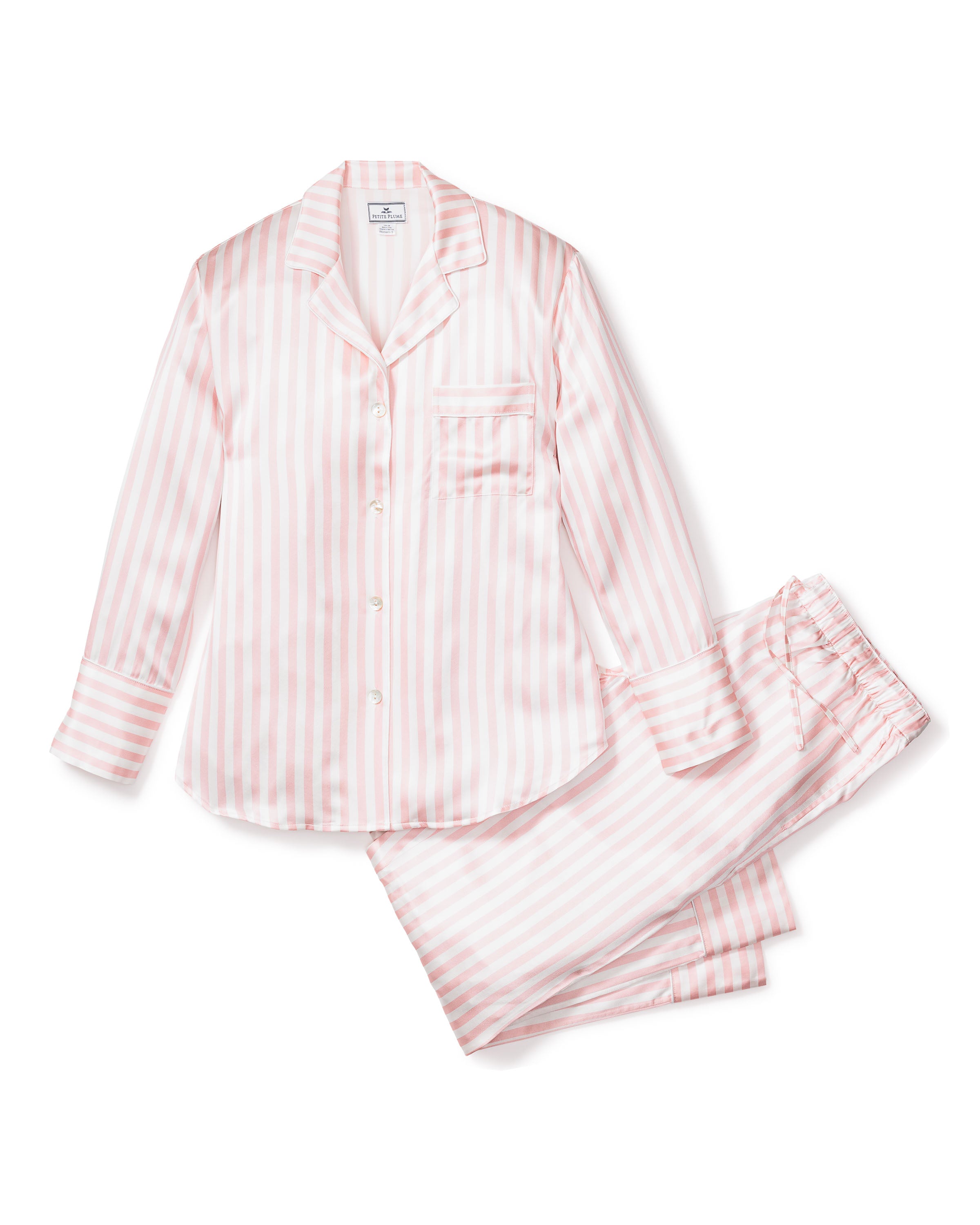 The Womens Silk Pajama Set in Pink Stripe by Petite Plume features a long-sleeve button-up top with a chest pocket and matching drawstring pants, made from luxury materials, all displayed on a white background.