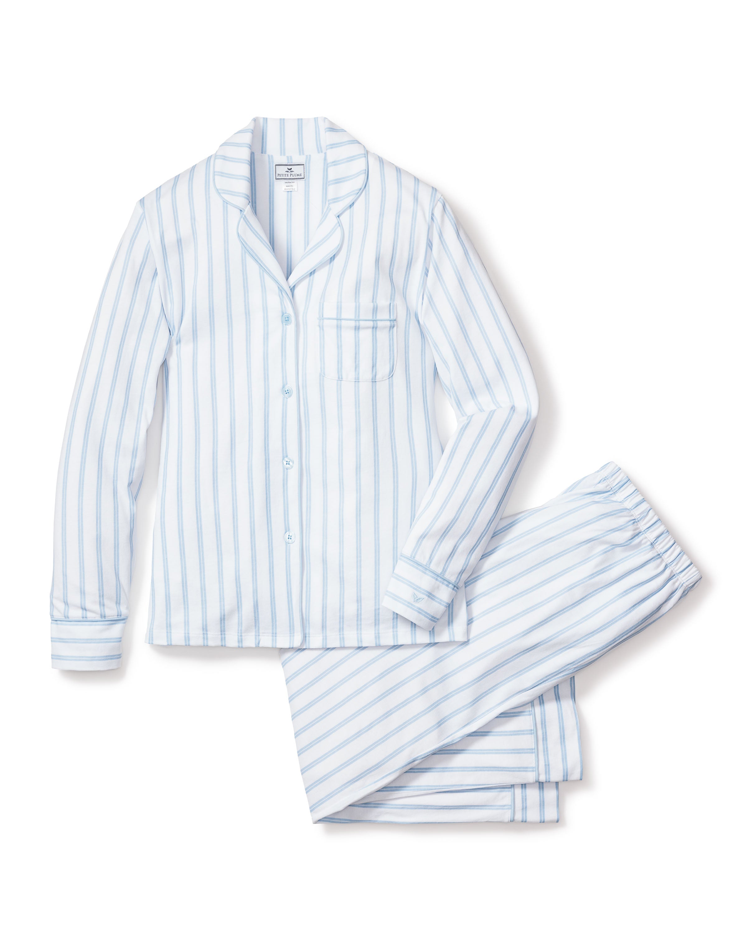 The Petite Plume Womens Pima Pajama Set in Periwinkle and White Stripe features classic button-up long sleeves, matching pants, and a chest pocket—luxury sleepwear in soft cotton with vertical stripes on white.