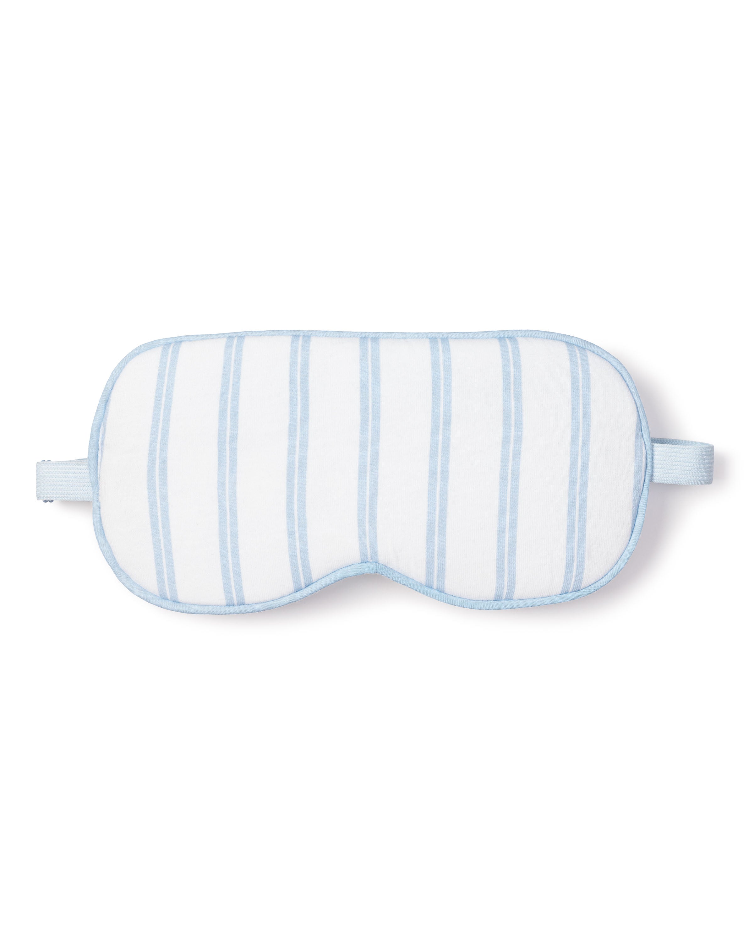 The Adults Sleep Mask in Periwinkle Stripe by Petite Plume features luxury white fabric with light blue stripes and a matching elastic strap. Perfect as an exquisite eye mask, it can also be personalized for a monogrammed gift, elegantly set against a plain white background.