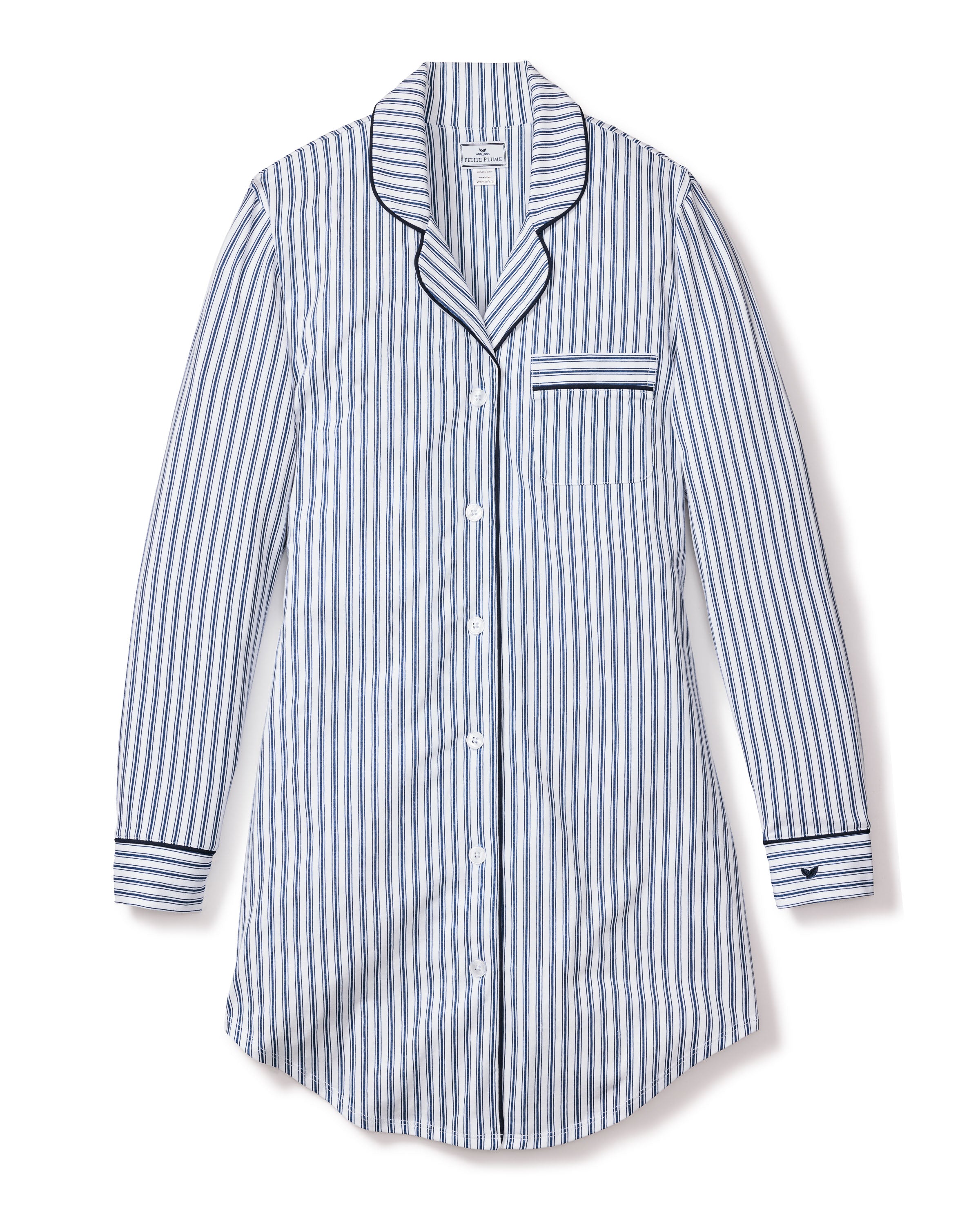 Enjoy the Petite Plume Womens Pima Nightshirt in Navy French Ticking, a long-sleeved blue-and-white striped nightshirt made from luxurious Pima cotton. It features a collar, button-down front, chest pocket with matching stripes, and dark borders on the cuffs for an elegant touch.