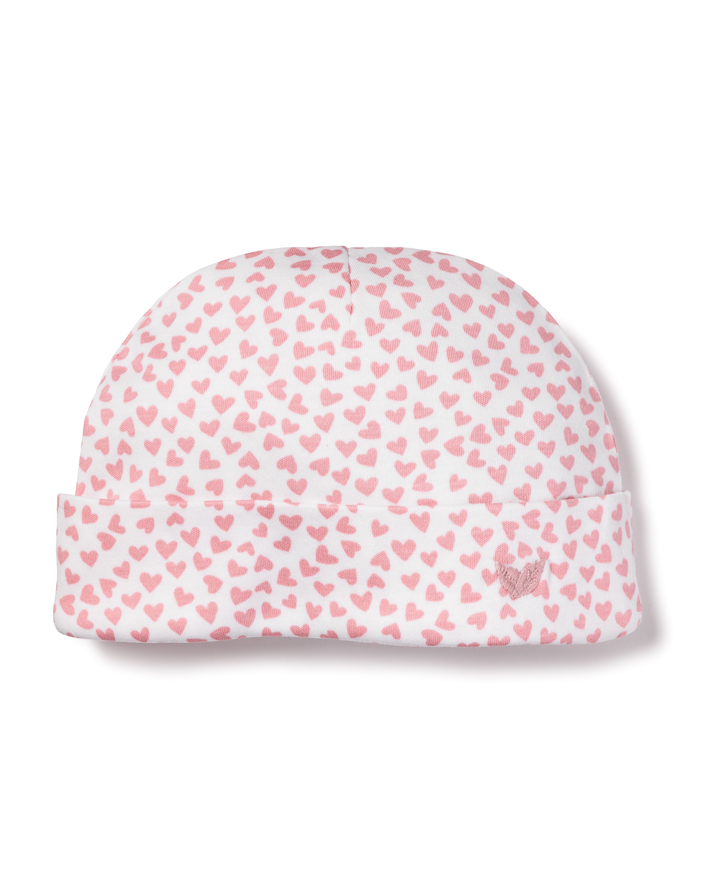 The Petite Plume Babys Pima Hat in Sweethearts, made from soft Peruvian Pima Cotton, features a folded brim with tiny pink hearts on white, perfect for your babys outfit.