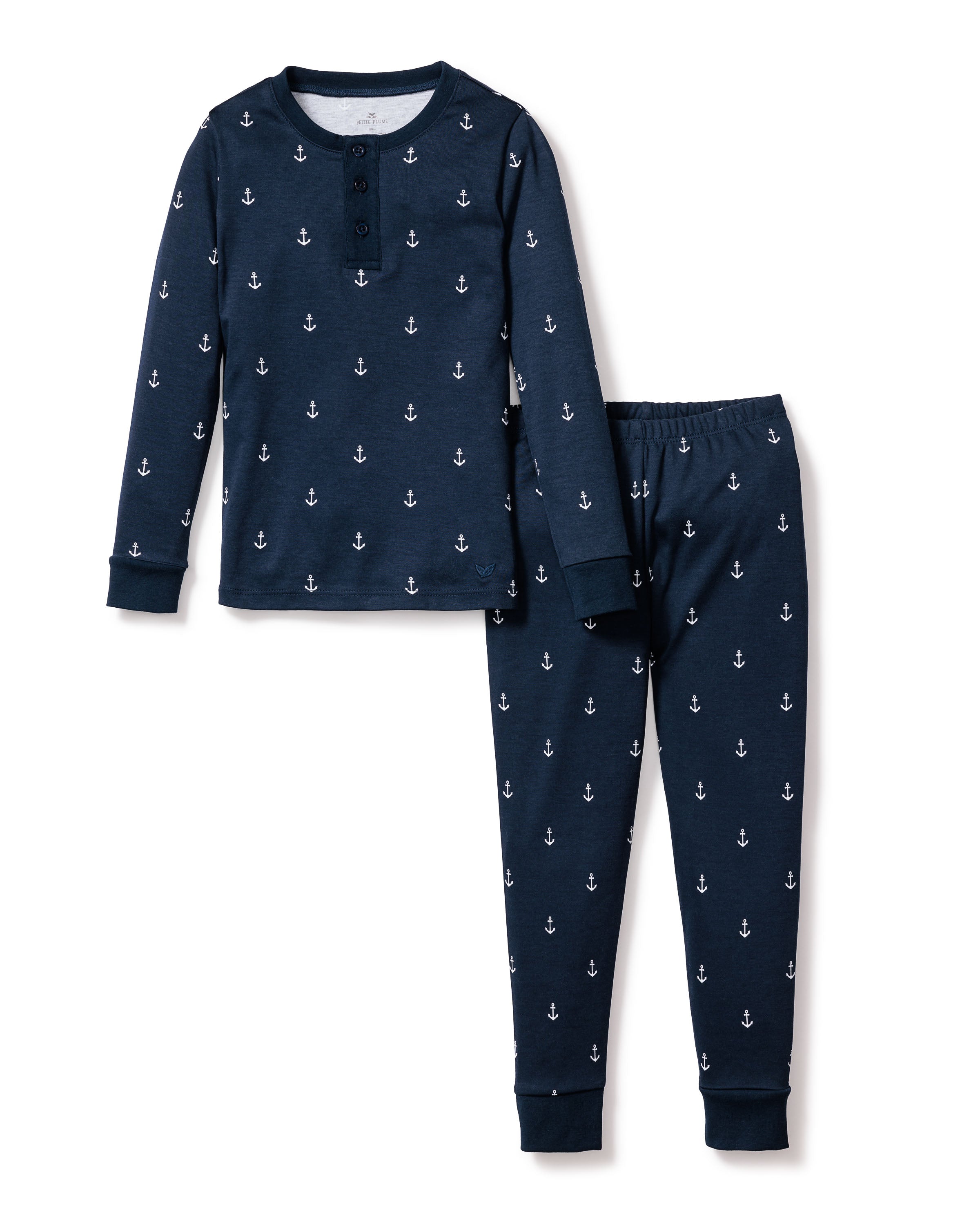 The Kids Pima Snug Fit Pajama Set in Portsmouth Anchors by Petite Plume, in navy blue, offers a long-sleeve buttoned top and matching pants. Crafted from soft Pima cotton with a white anchor pattern, the set ensures comfort and style for your little ones.