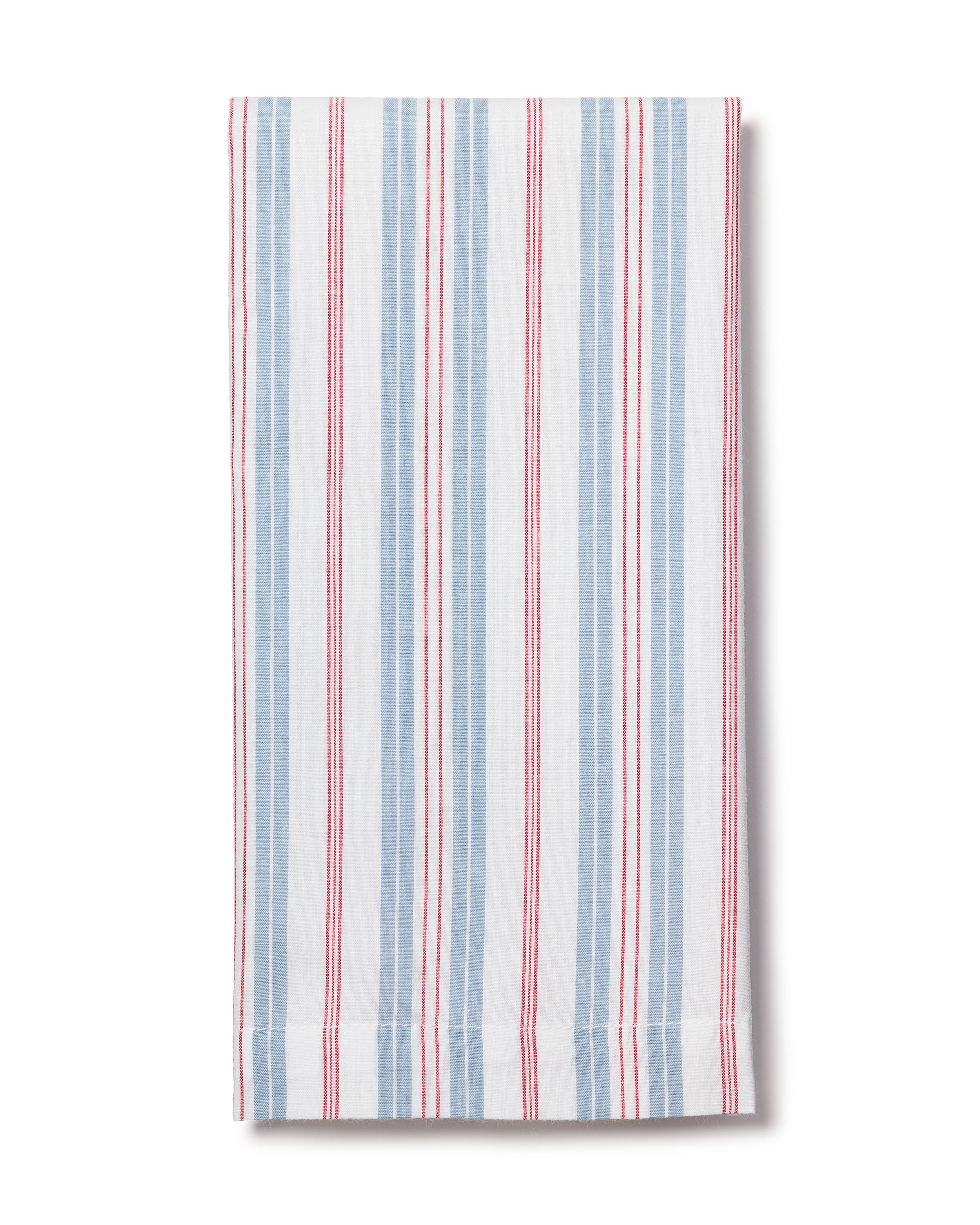 The Petite Plume Signature Twill Napkins showcase a classic striped design with 100% cotton and vertical red, white, and blue stripes on a plain white background, resembling vintage French style. Neatly folded, they complement any table linen collection.