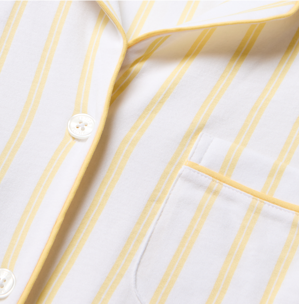 Close up of yellow and white stripe pajama top