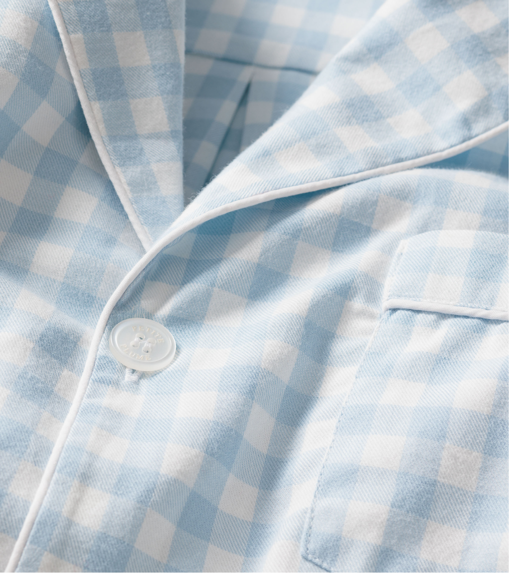 Close up of light blue and white pajama top