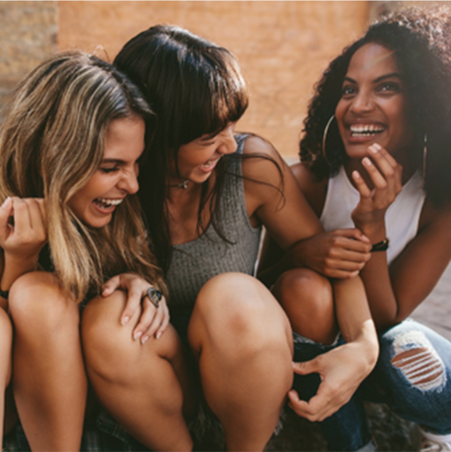 3 women laughing together