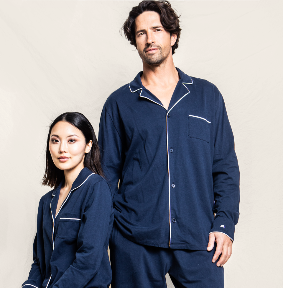 Man and women in matching Navy blue pajamas