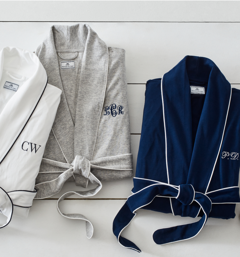 Group image of 3 robes in white, grey and navy. Each robe has initials monogrammed on the right side of the robe Group image of 3 robes in white, grey and navy. Each robe has initials monogrammed on the right side of the robe