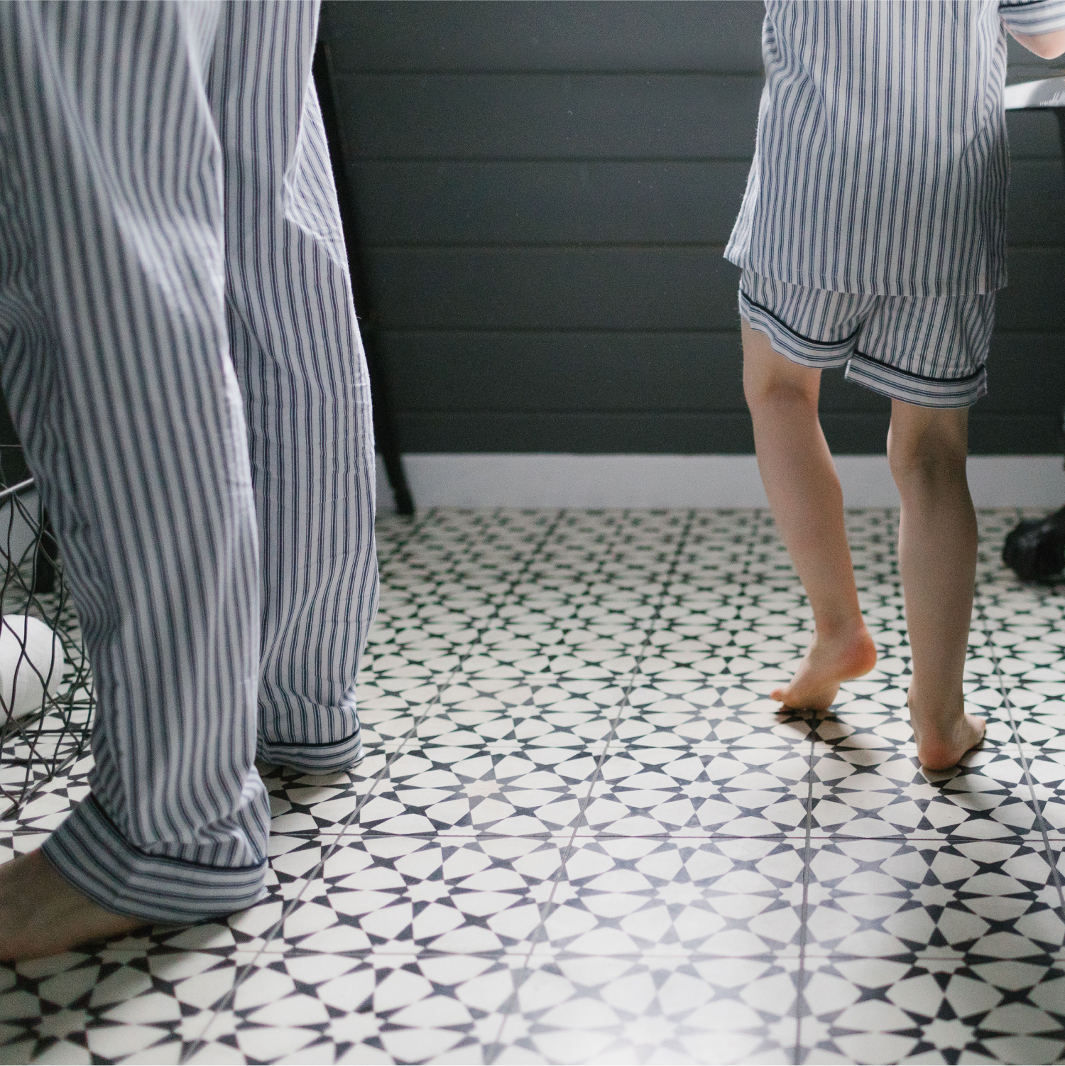 Father and Son in blue and white pajamas in the a bathroom