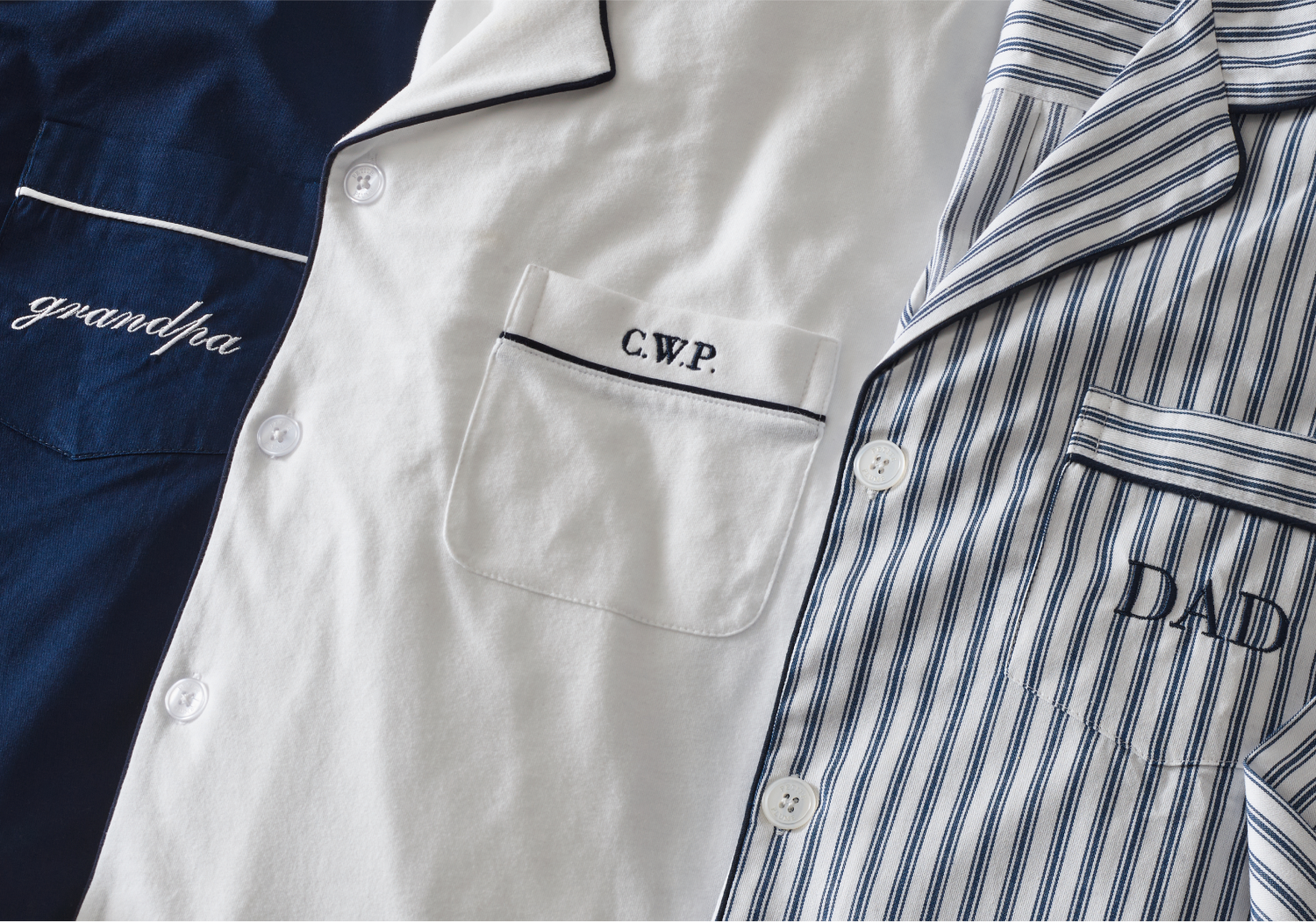 Navy and white pajama tops embroidered with initials on pajama pocket
