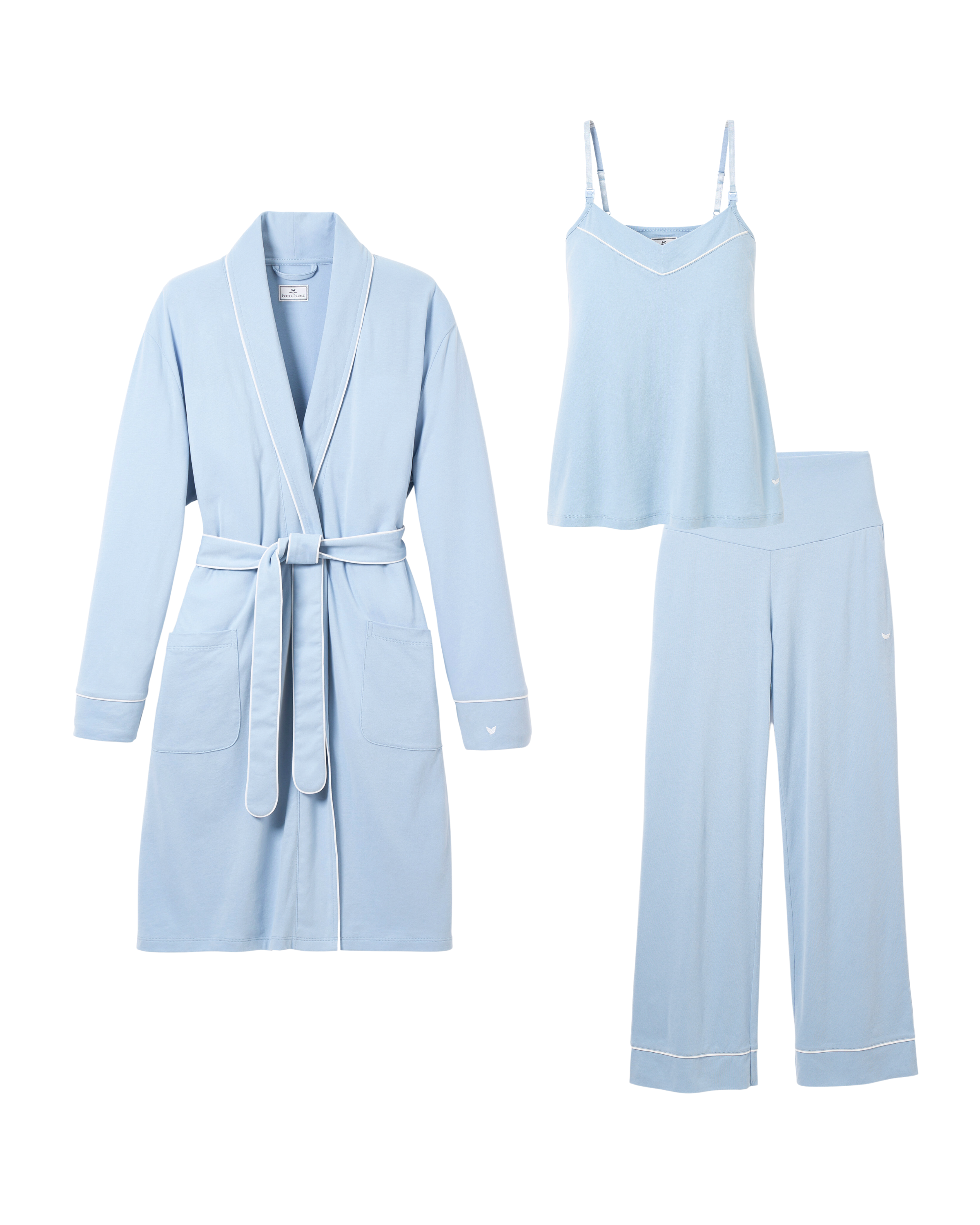 Indulge in luxurious relaxation with Petite Plumes Cozy Maternity Set in Periwinkle. This stylish set features a robe with white trim and belt, a camisole tank with spaghetti straps, and loose-fitting pants adorned with white piping—ideal for pampering or gifting elegantly.