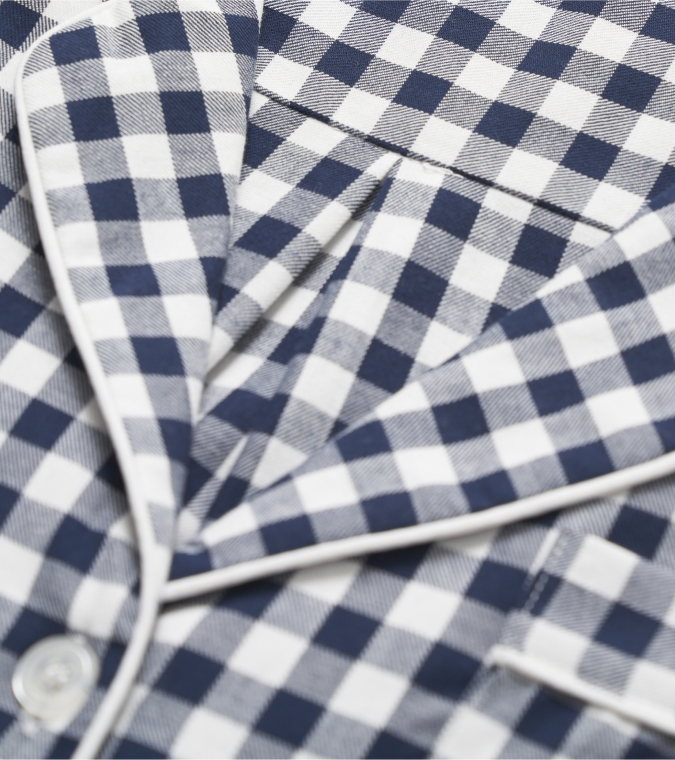 Close up of navy and white gingham pajama top
