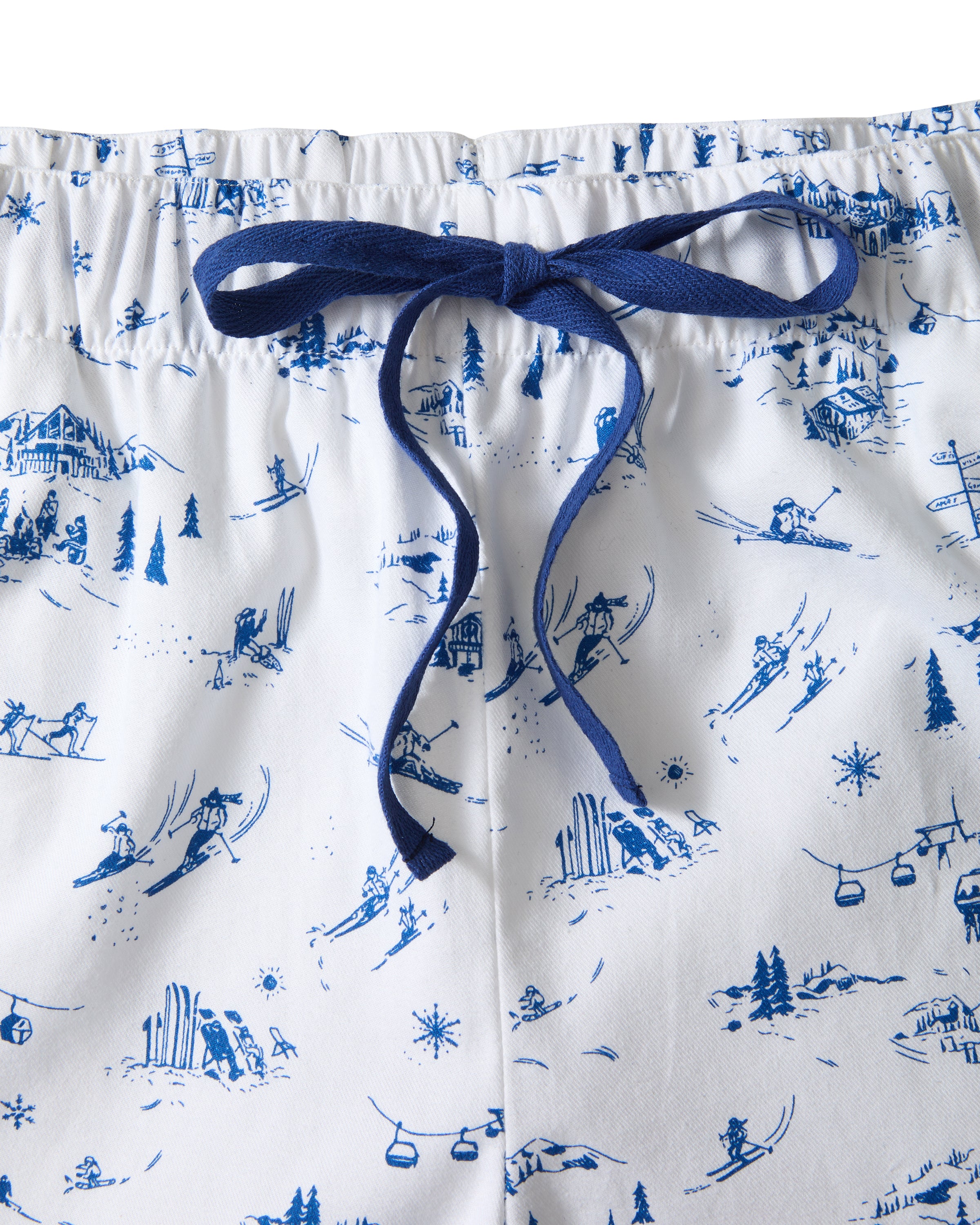 Men's Twill Pajama Pants in Chalet Toile, featuring a blue scenic toile print, navy drawstring at the elastic waist, and blue stitched cuffs. Pants are displayed flat on a white background.
