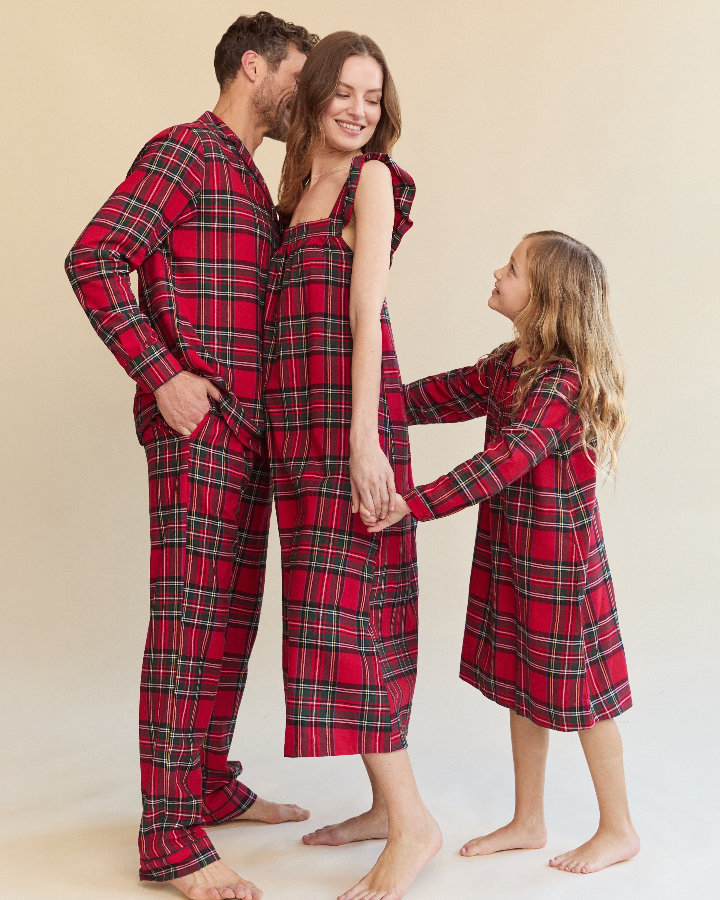 The Men's Brushed Twill Pajama Set in Imperial Tartan features a red plaid design with green, white, and black stripes, a button-up long-sleeve top with a chest pocket, and matching pants, displayed neatly on a white background.