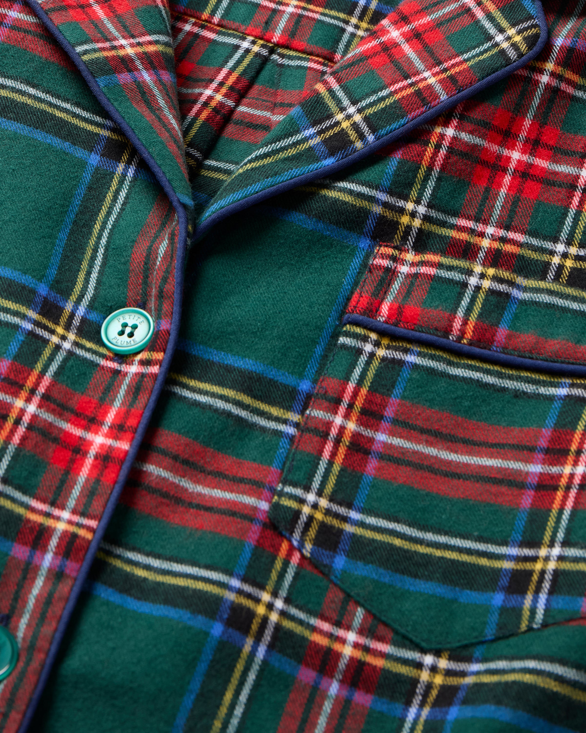 The Men's Brushed Twill Pajama Set in Kensington Tartan features a button-up long-sleeve shirt and matching drawstring pants in a classic green, red, yellow, and blue plaid pattern.