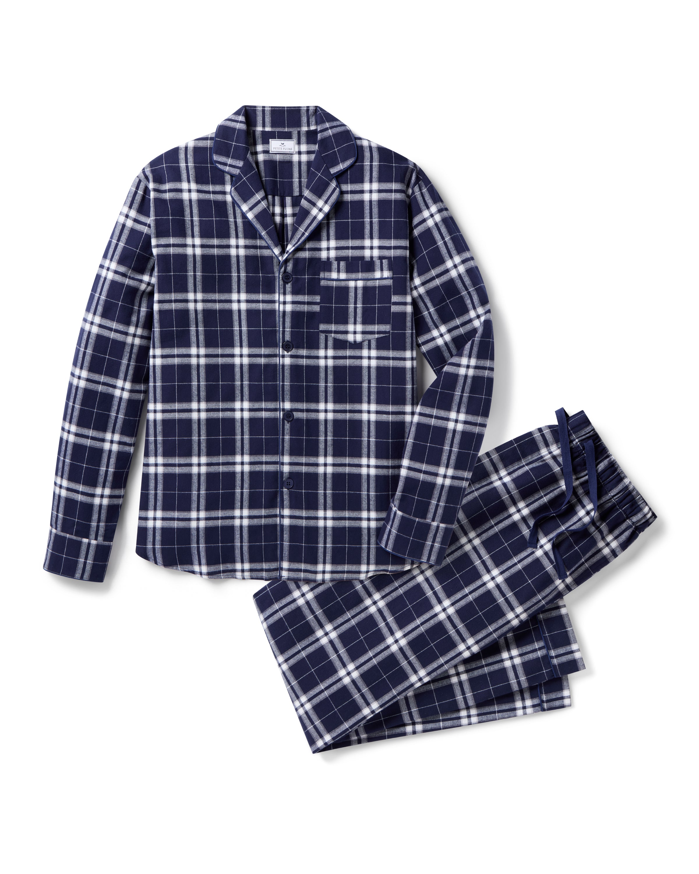 The Men's Brushed Twill Pajama Set in Oxford Tartan includes a two-piece navy and white plaid design with a long-sleeved button-up shirt featuring a chest pocket and matching drawstring pants.
