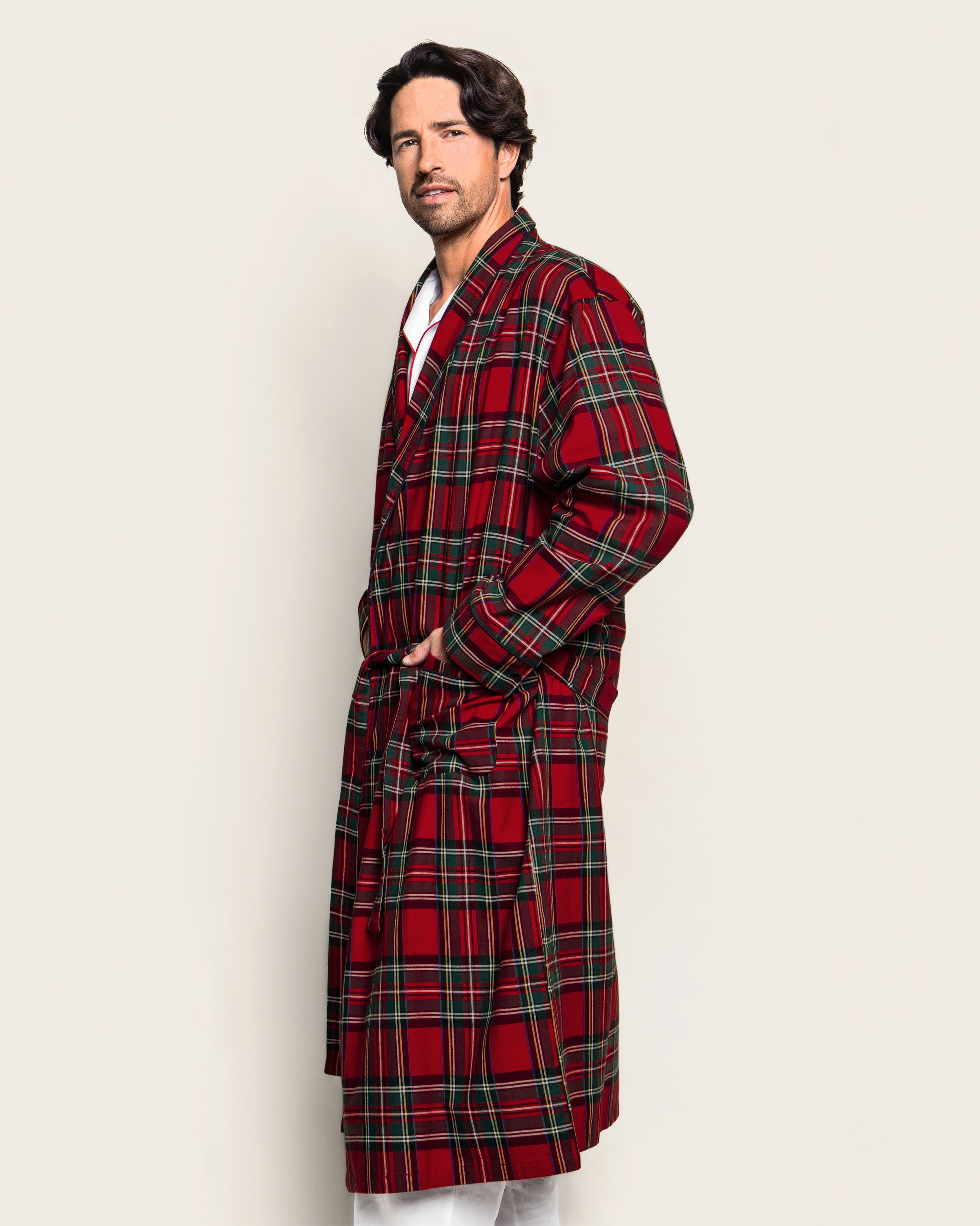The Men's Brushed Twill Robe in Imperial Tartan features a red, green, and black plaid pattern, long sleeves, a shawl collar, knee-length cut, and includes a matching fabric belt for tying at the waist.