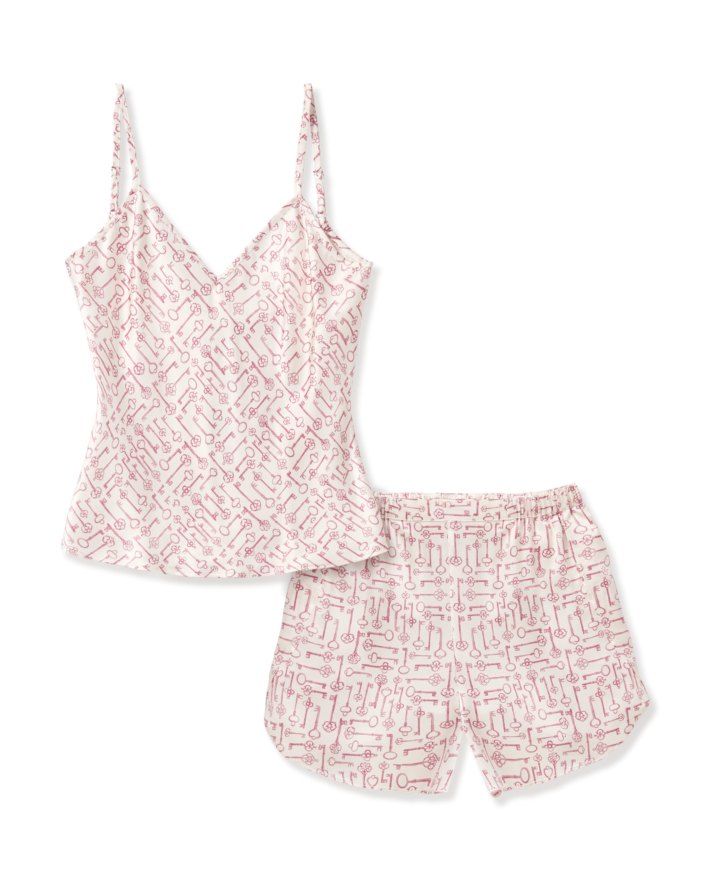 The Women's Silk Cami Short Set in Key to My Heart features a white camisole with thin straps, a crossover front, and matching shorts with an elastic waist, all adorned with a pink vintage-style key pattern.