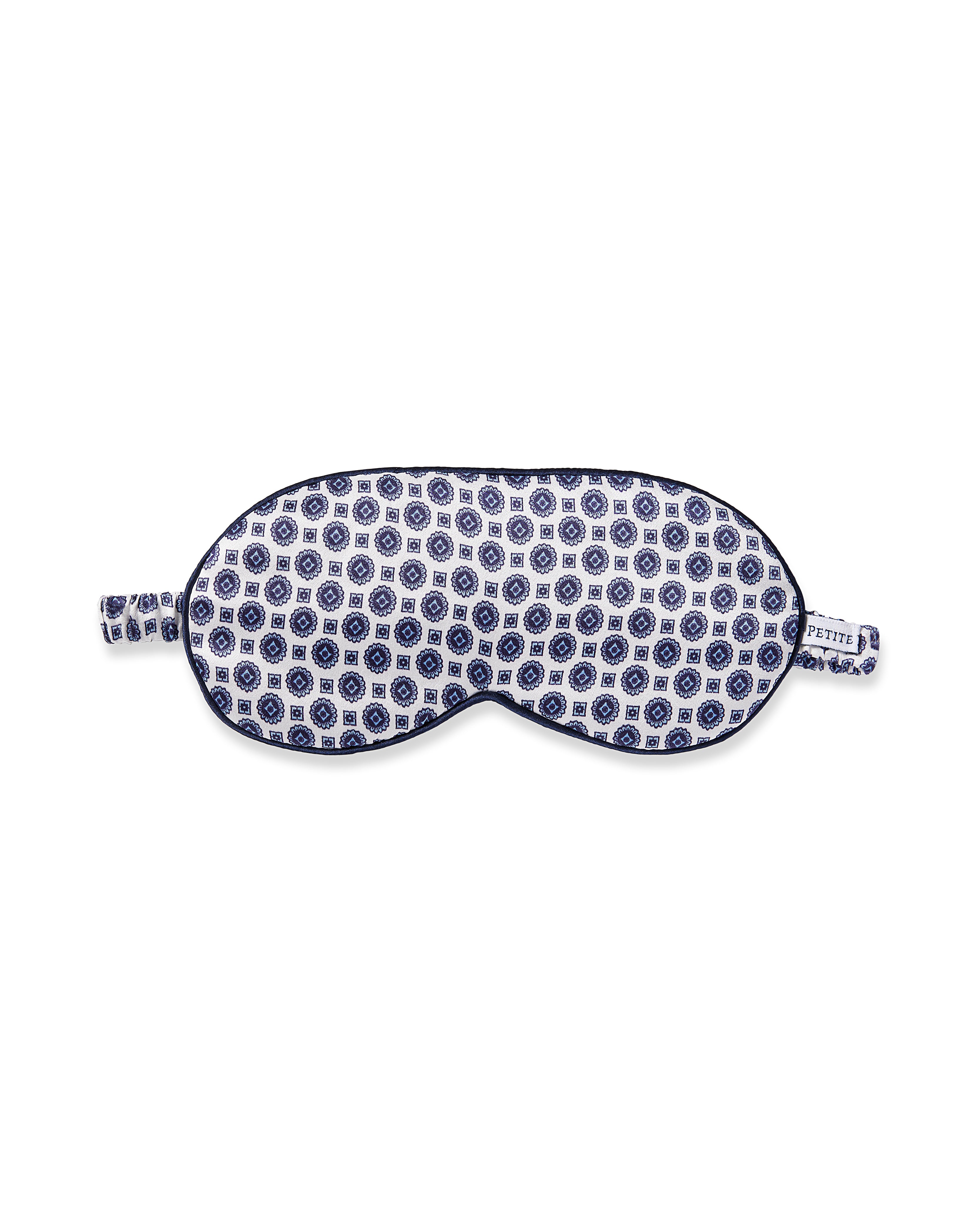 Experience the sweetest dreams with Petite Plumes Adults Silk Sleep Mask in Navy Foulard, crafted from pure silk and featuring a stylish blue and white circular pattern for ultimate comfort and elegance during your nightly rest.