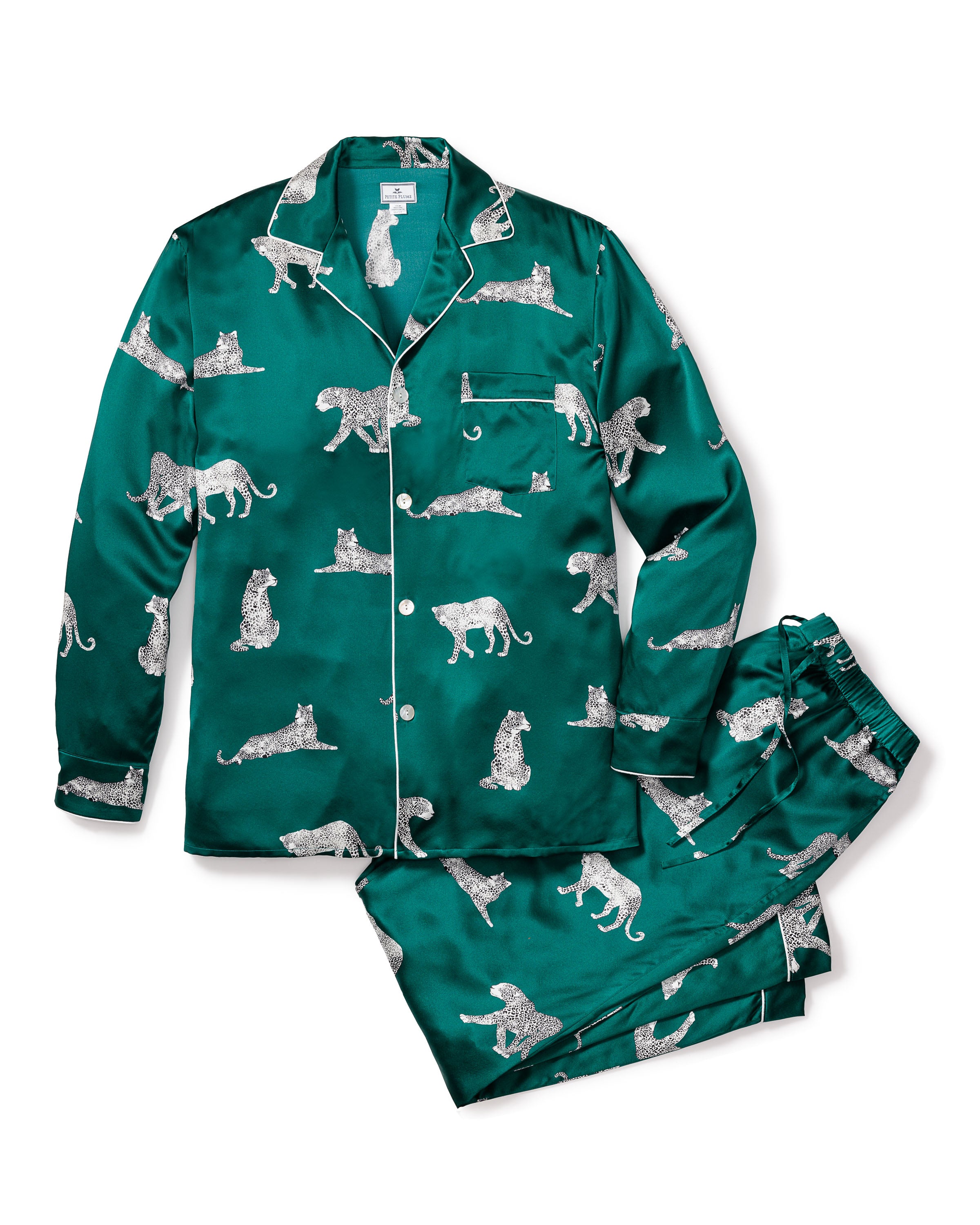 Indulge in luxury with the Mens Silk Pajama Set in Panthère de Luxe by Petite Plume. This emerald green set with a white leopard print features a collared, button-up top with a chest pocket and pants with a drawstring waist for optimal comfort and elegance.
