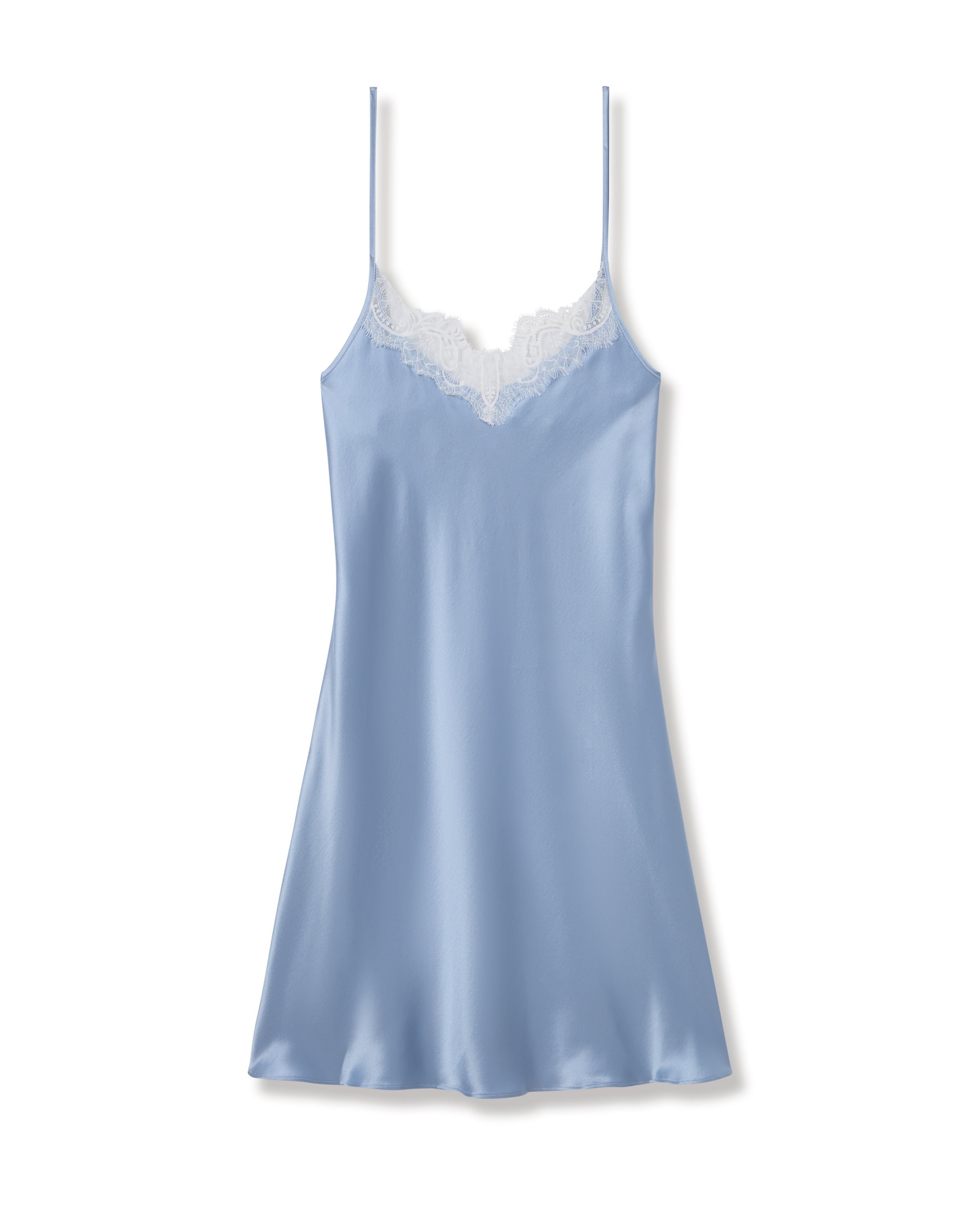 The Womens Silk Lace Slip Dress in Periwinkle by Petite Plume embodies minimalist nightdress elegance with its light blue satin silk, thin shoulder straps, and white lace neckline trim, all set against a plain white background.