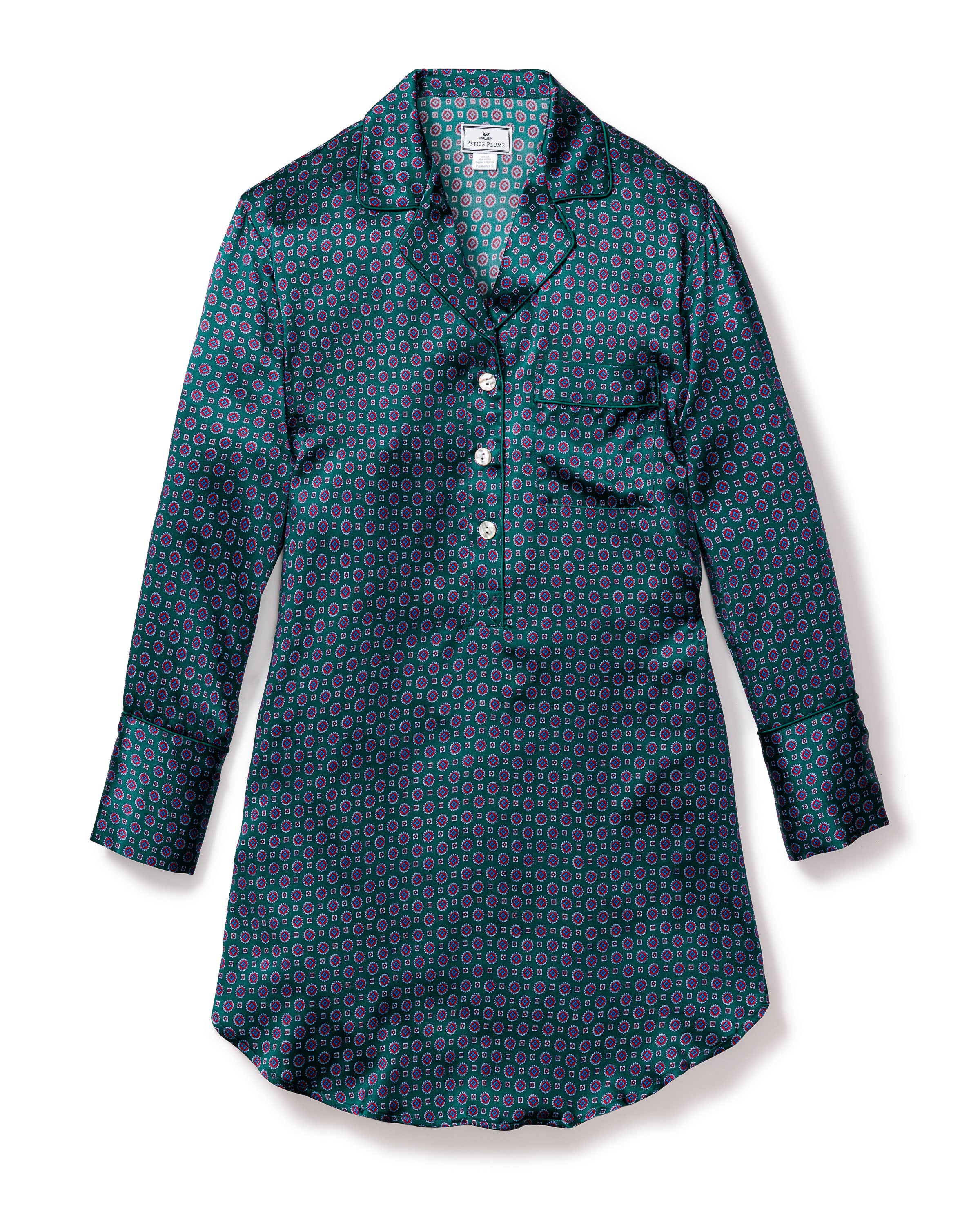The Womens Silk Nightshirt in Emerald Foulard by Petite Plume is a luxurious long-sleeved, button-up shirt made from mulberry silk, featuring a dark teal background with red and light blue circular patterns, a single left-side pocket, and a folded collar for an elegant addition to your sleepwear collection.