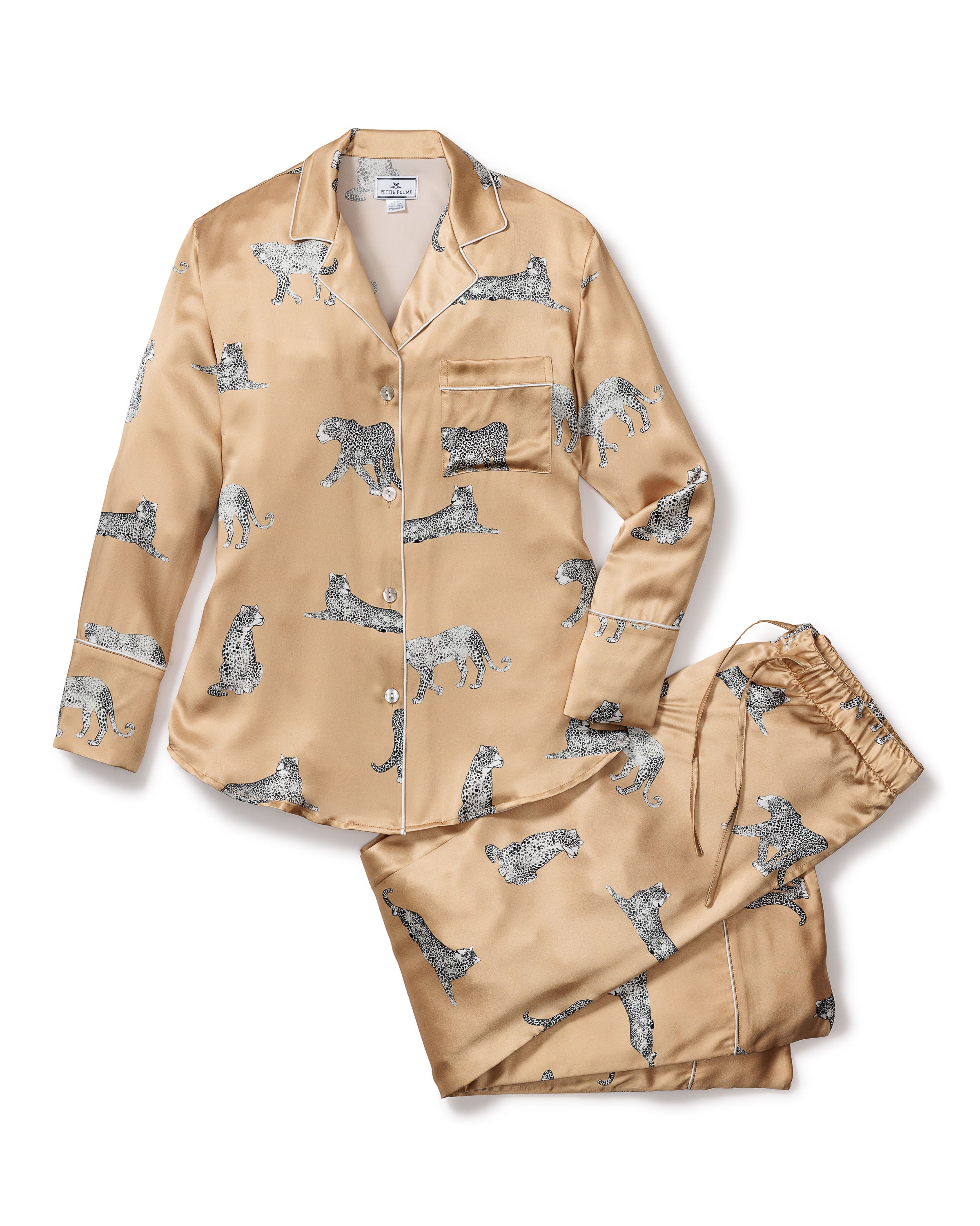 Experience luxury with Petite Plumes Womens Silk Pajama Set in Panthère Champagne. This Mulberry silk set includes a golden satin, long-sleeve buttoned shirt with a pocket and matching pants featuring an elegant panther motif, elastic waistband, and drawstring for ultimate comfort.