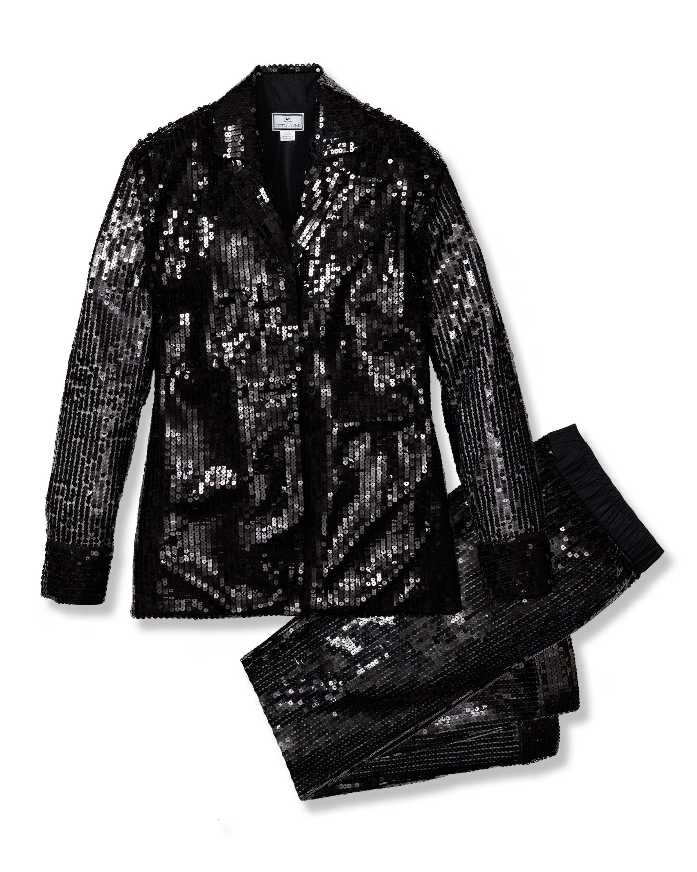 The Womens Pajama Set in Black Sequins by Petite Plume features a shimmering jacket with a notched lapel and coordinated pants. The tailored fit and pajama silhouette balance glamour and comfort for sophisticated style.