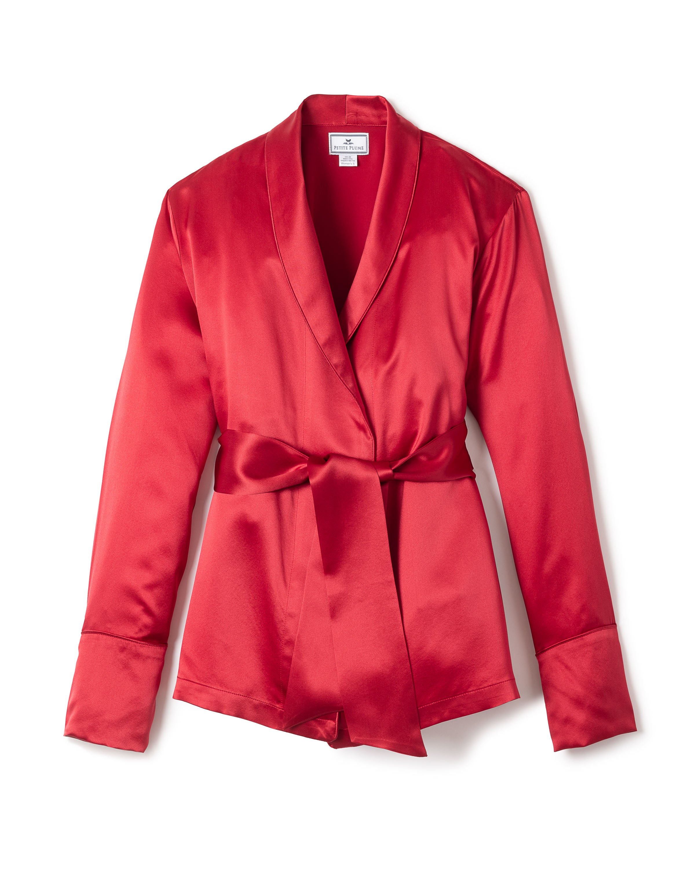 Petite Plumes Womens Silk Short Robe in Crimson features a wide lapel, long sleeves with elegant cuffs, and a waist tie belt. The hypoallergenic fabric provides a shiny finish, and the robe is showcased against a white background.