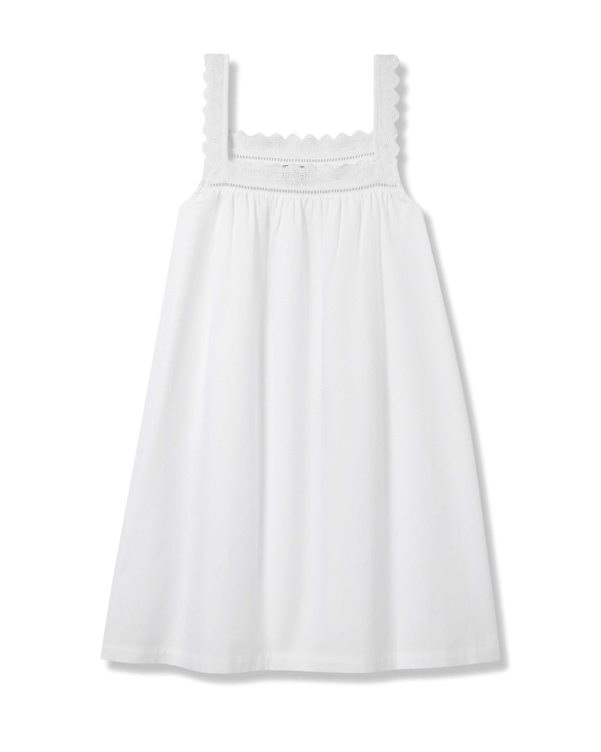 The Womens Twill Esme Nightgown in White by Petite Plume is a sleeveless white dress with a square neckline, crafted from luxury cotton. It features scalloped trim and embroidery, with eyelet detailing throughout the light fabric, perfect for warm weather.