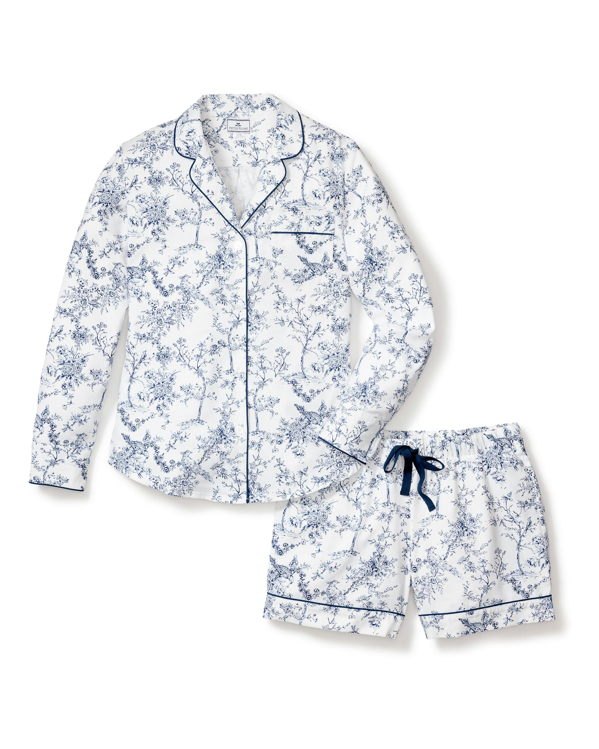Blue and white floral pajama set on a white background