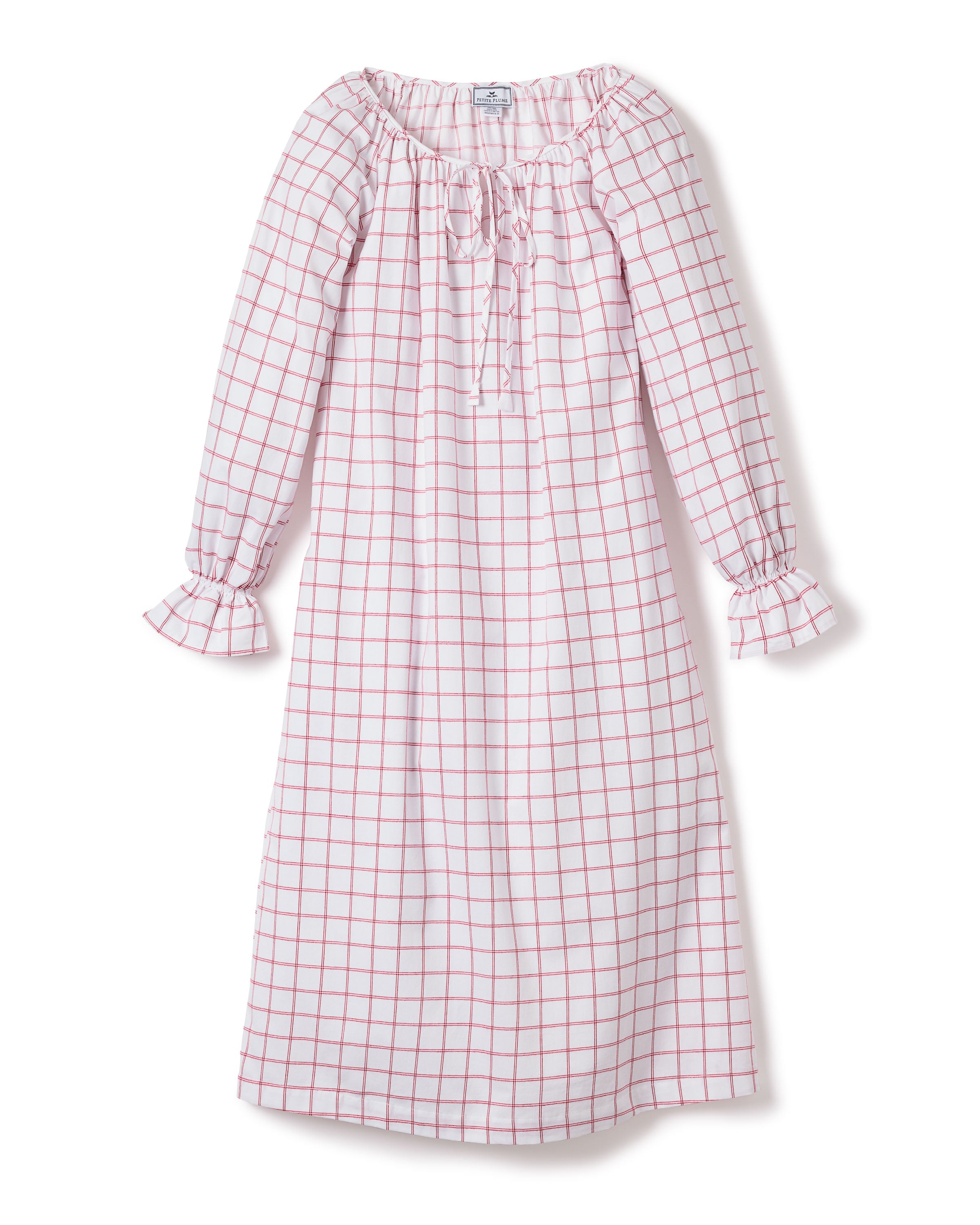 The Womens Twill Delphine Nightgown by Petite Plume in Garnet Tattersall is a knee-length, long-sleeved dress made of high-quality cotton twill with pink check patterns on white. It features a ruffled collar with tie detail and ruffled cuffs, ideal for adding elegance to any occasion.