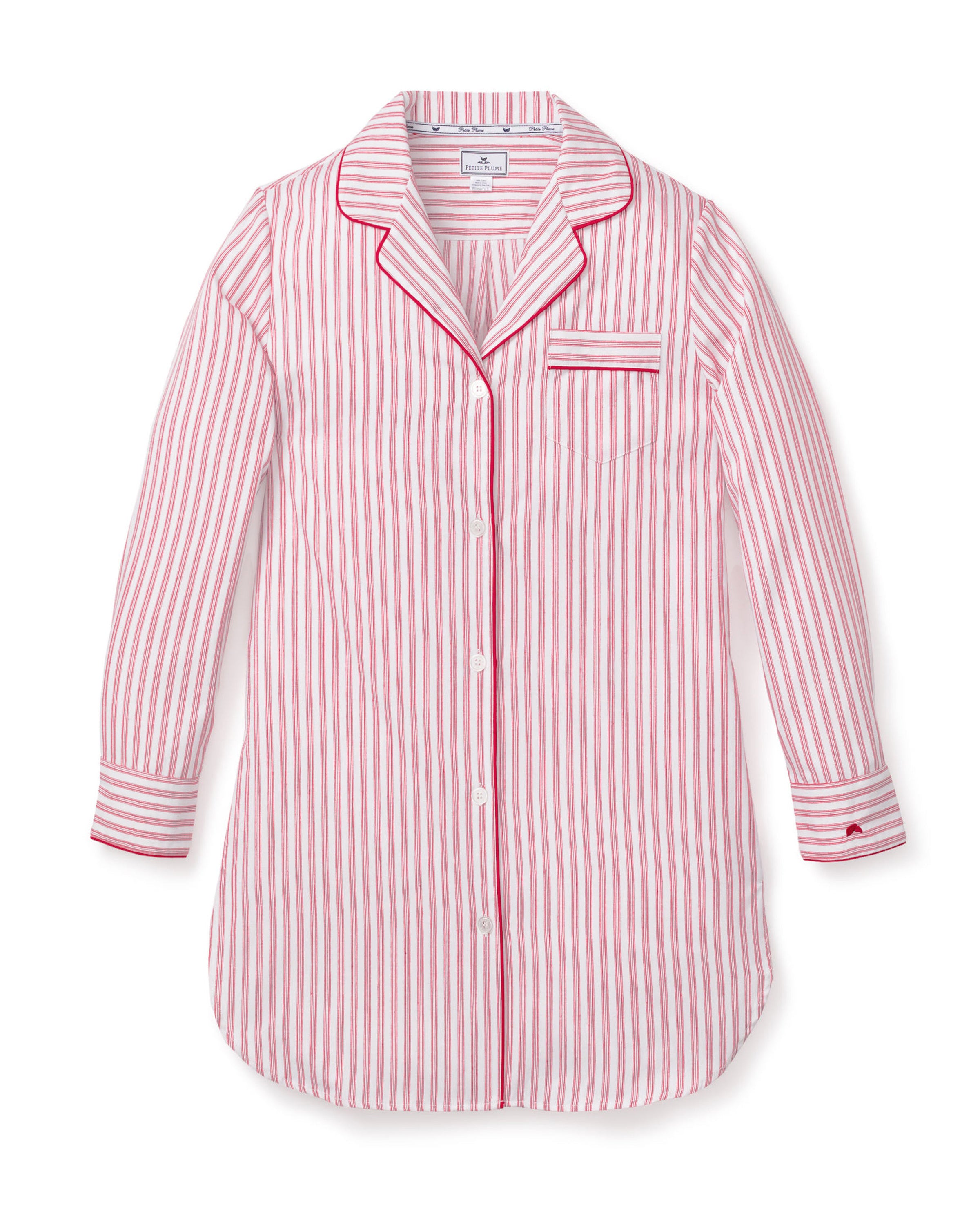 Close-up of the Womens Twill Nightshirt in Antique Red Ticking by Petite Plume, showcasing white fabric with vertical red pinstripes. Made from the finest quality cotton, it features a buttoned shirt with a notched collar and chest pocket, detailed with matching striped edges.
