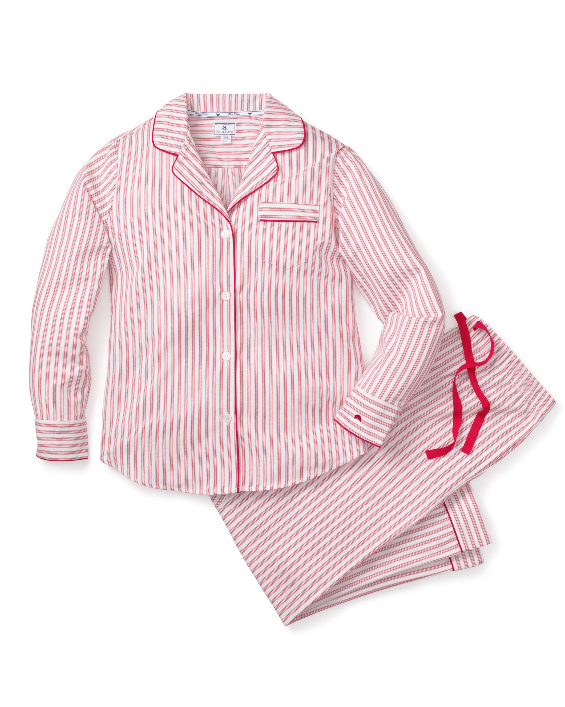 The Womens Twill Pajama Set in Antique Red Ticking by Petite Plume features a white shirt with red vertical stripes, front pocket, and button closure. Made from soft, lightweight fabric, the classic pattern offers comfort for sleepwear or casual wear.