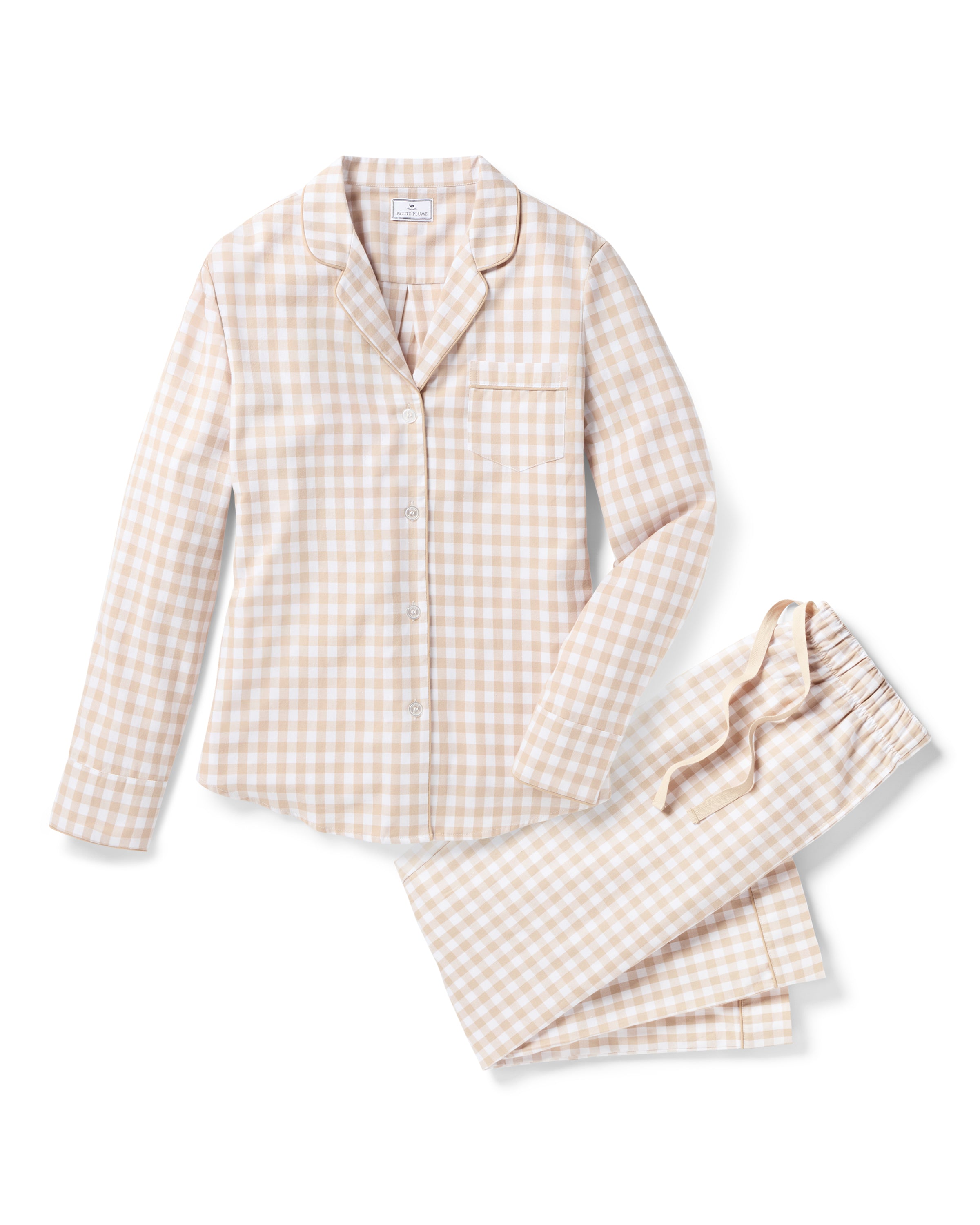 The Women's Twill Pajama Set in Camel Gingham features a beige and white check long-sleeve, button-up top with chest pocket and matching drawstring pants, displayed neatly on a white background.