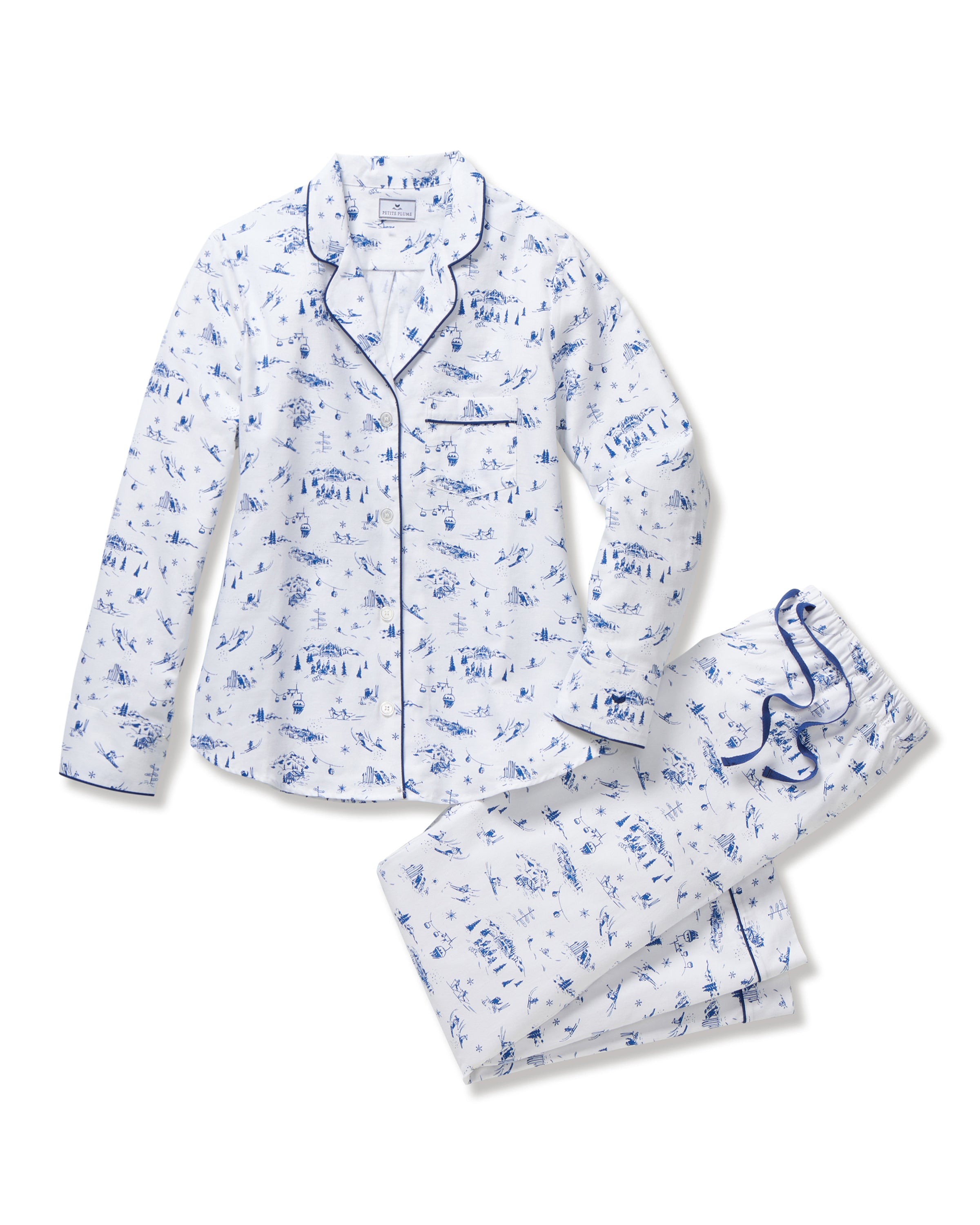 Women's Twill Pajama Set in Chalet Toile, featuring a white long-sleeve button-up shirt and matching pants with blue piping and a blue toile pattern, neatly displayed on a white background.