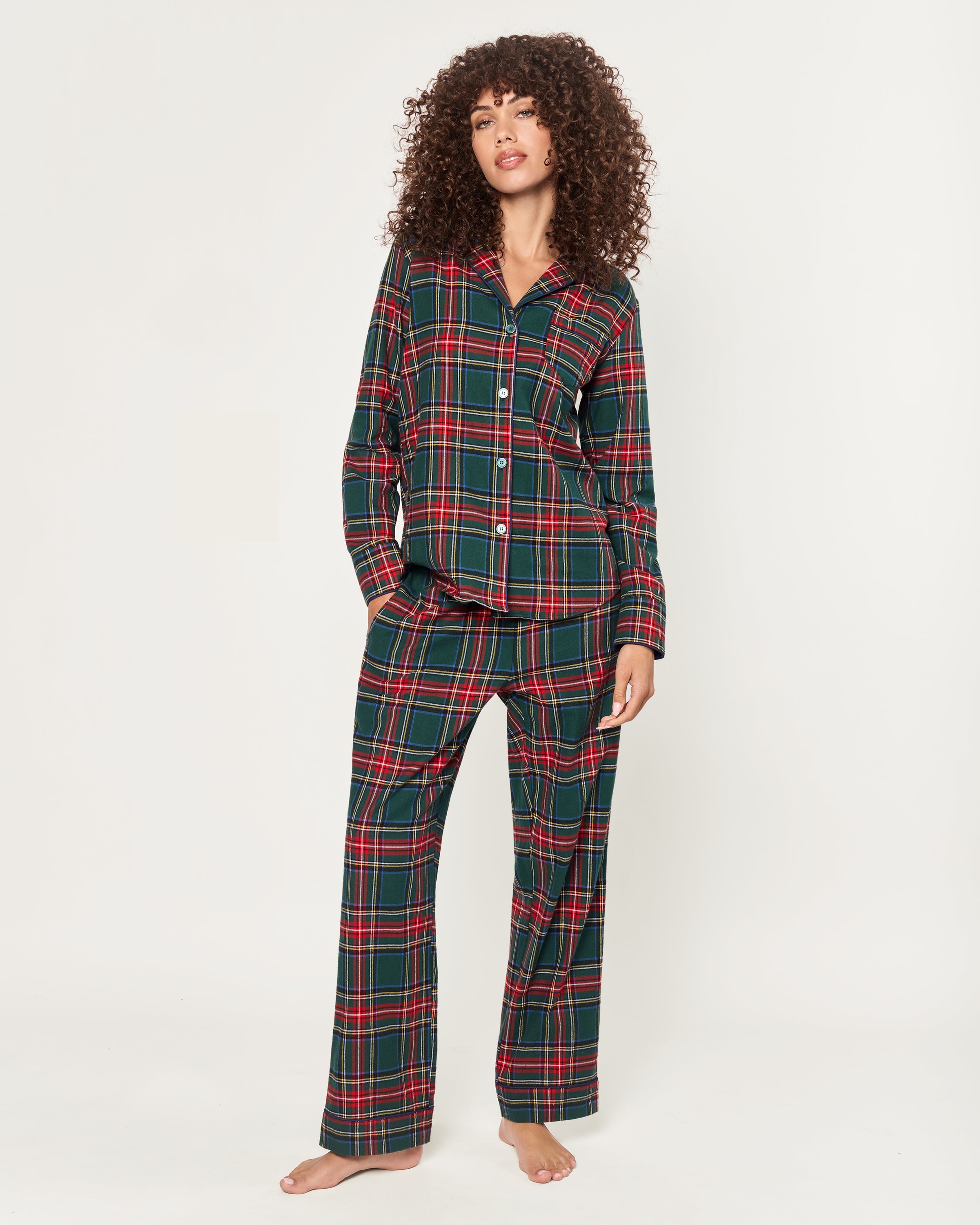 The Women's Brushed Twill Pajama Set in Kensington Tartan features a cozy green, red, and white plaid with a long-sleeve button-up top with chest pocket and matching elastic-waist pants.
