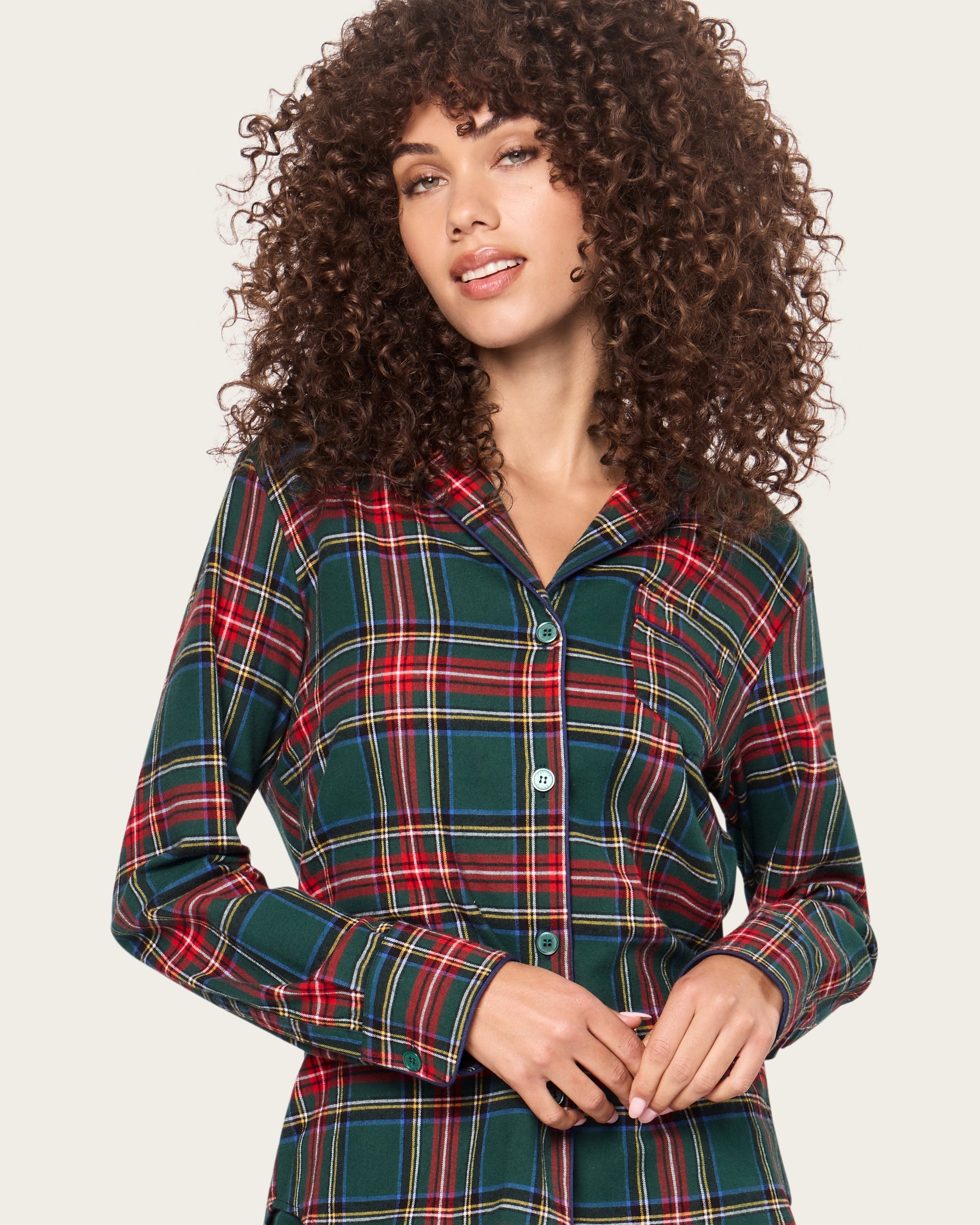 The Women's Brushed Twill Pajama Set in Kensington Tartan features a cozy green, red, and white plaid with a long-sleeve button-up top with chest pocket and matching elastic-waist pants.