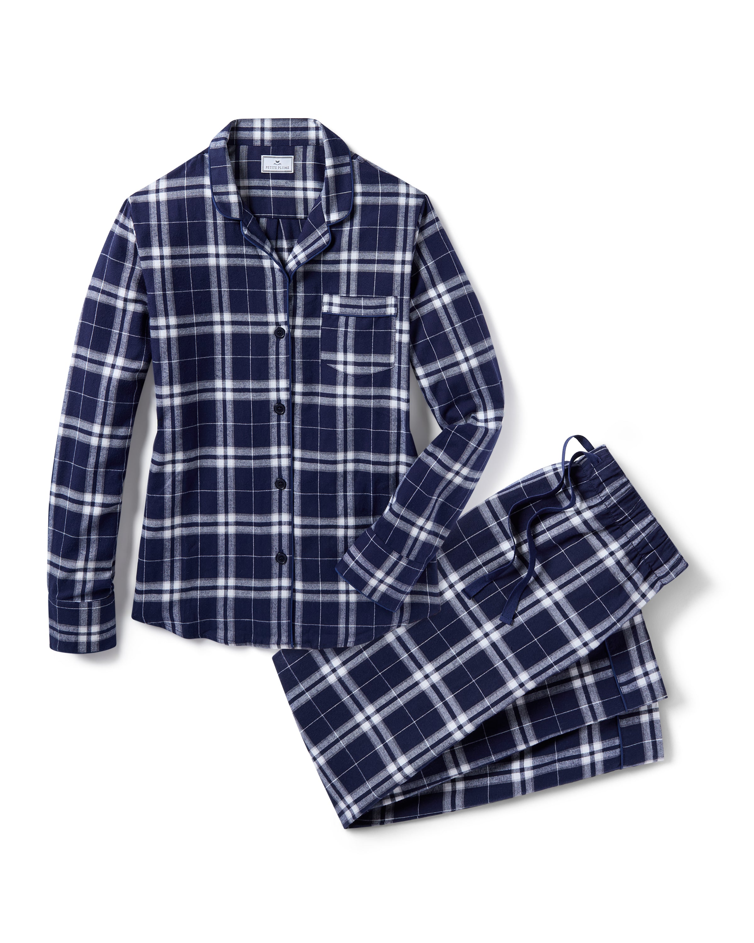 The Women's Brushed Twill Pajama Set in Oxford Tartan features a blue and white plaid long-sleeve button-up shirt with a chest pocket and matching drawstring pants, all displayed on a white background.