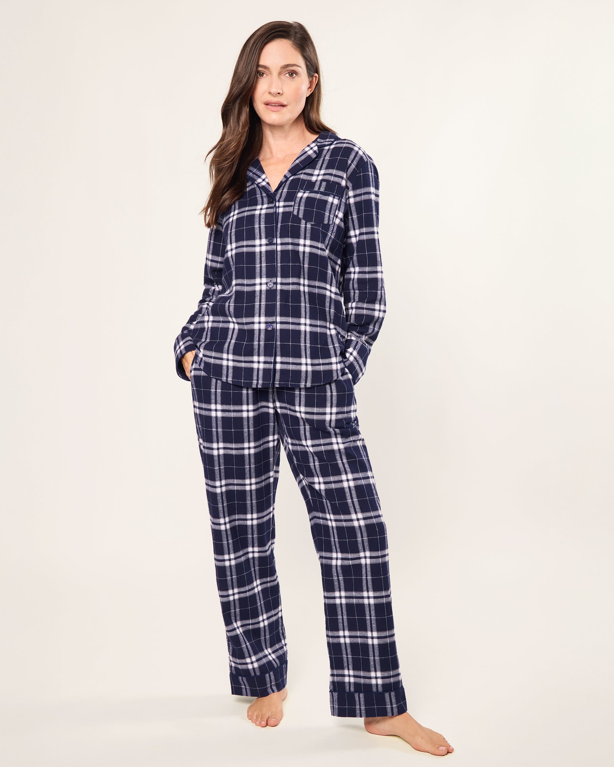 The Women's Brushed Twill Pajama Set in Oxford Tartan features a blue and white plaid long-sleeve button-up shirt with a chest pocket and matching drawstring pants, all displayed on a white background.
