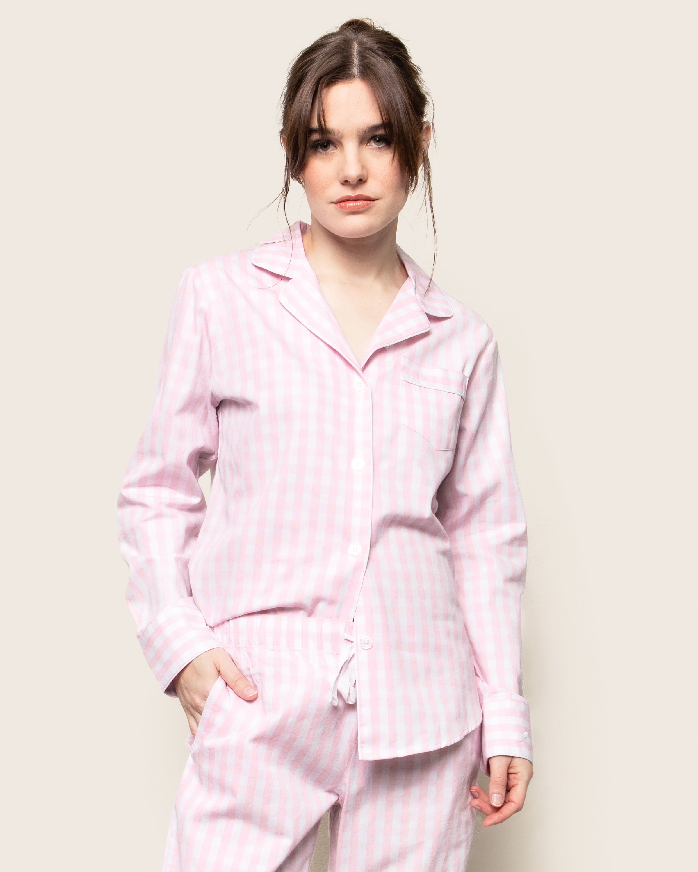 Women's Twill Pajama Set in Pink Gingham features a long-sleeve button-up top with a chest pocket and matching drawstring pants, shown laid flat on a white background.