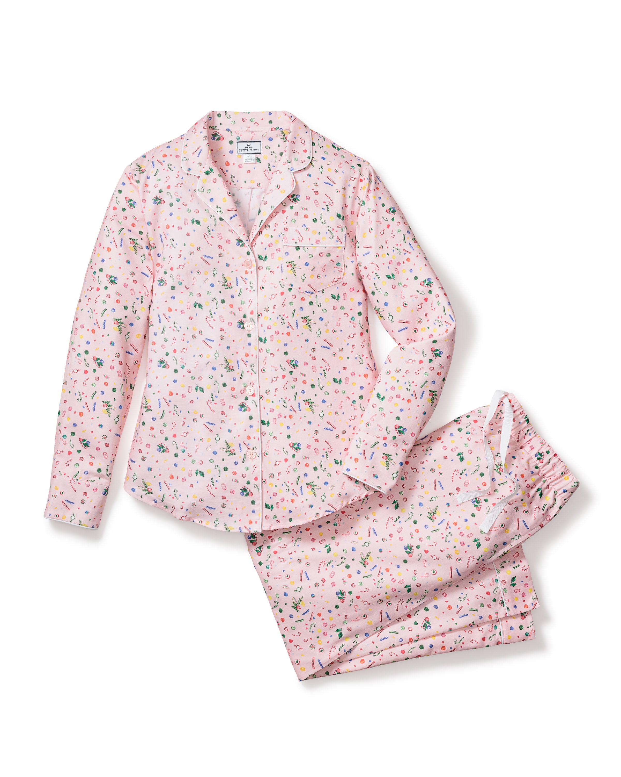The Womens Twill Pajama Set in Vintage Sweets by Petite Plume showcases a colorful abstract confetti pattern on light pink cotton twill. The set includes a long-sleeve button-up top with a collar and matching pants, all displayed flat against a white background.