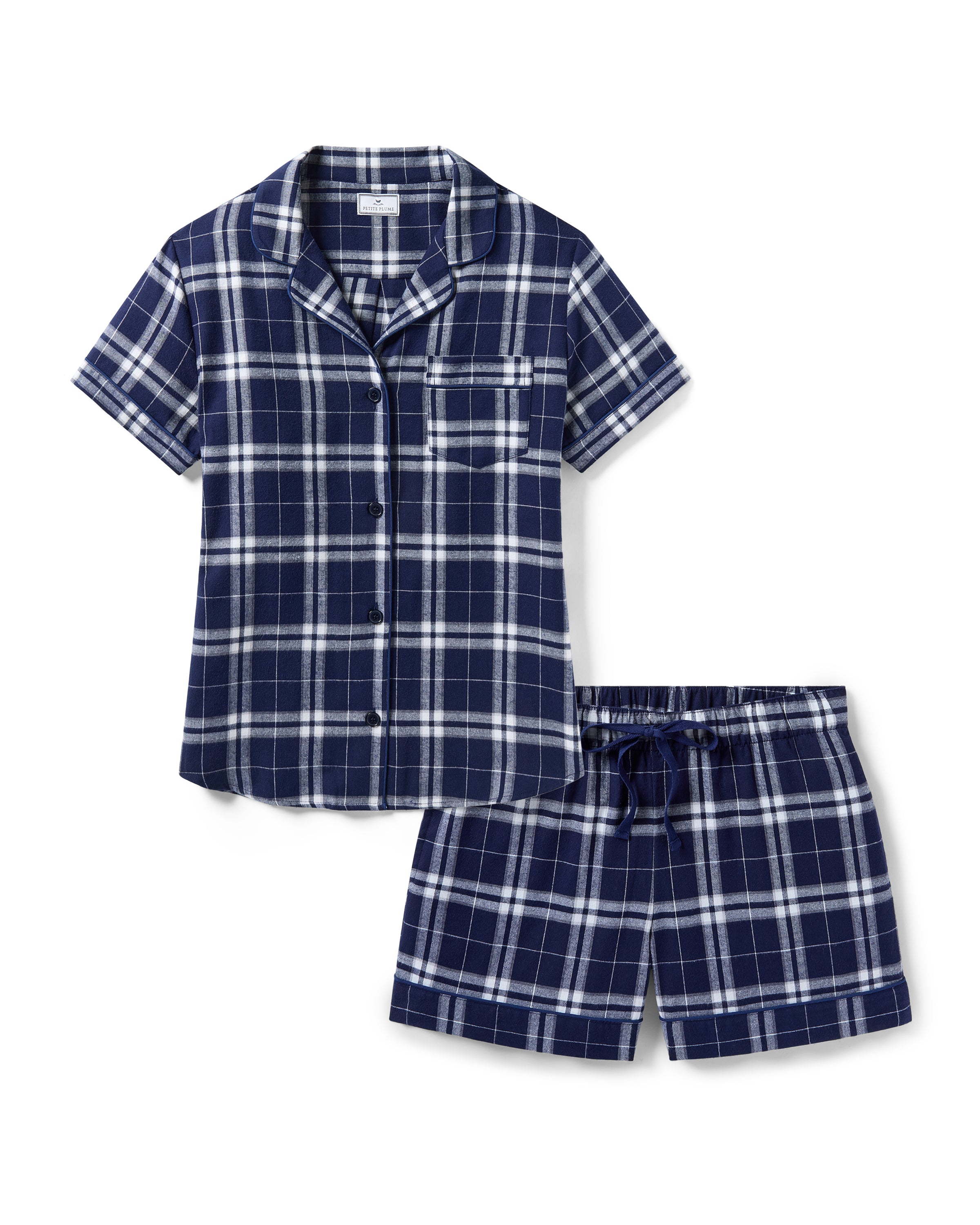 The Women's Brushed Twill Short Sleeve Short Set in Oxford Tartan features a navy and white plaid pattern, a short-sleeve button-up shirt with chest pocket, and drawstring shorts—perfect for a coordinated pajama look.